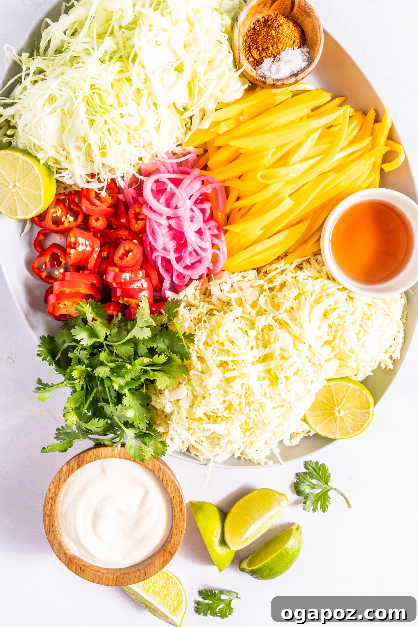 Fresh ingredients for Easy Caribbean Coleslaw displayed on a wooden board.