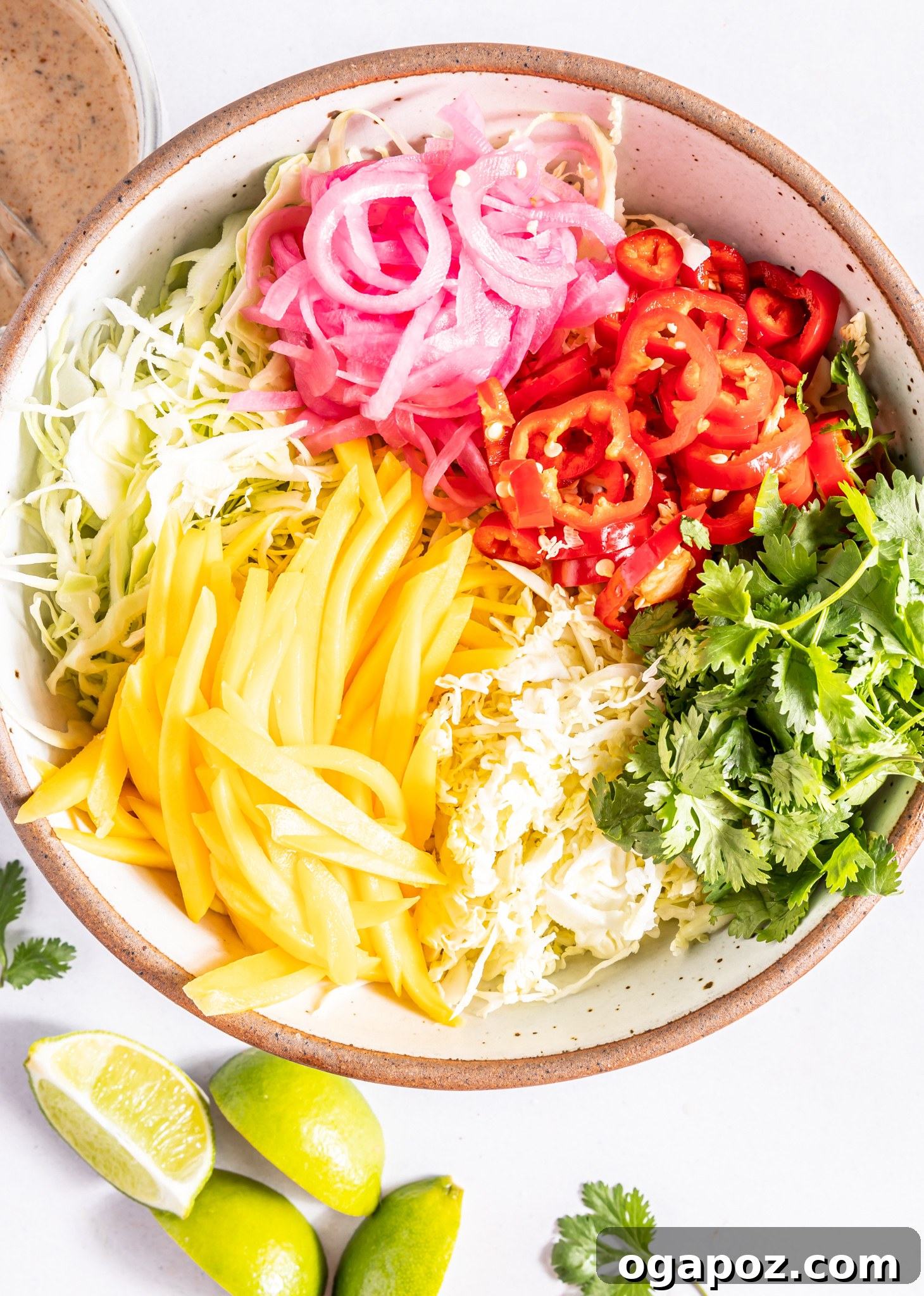 Caribbean Coleslaw dressing ingredients whisked in a small bowl.