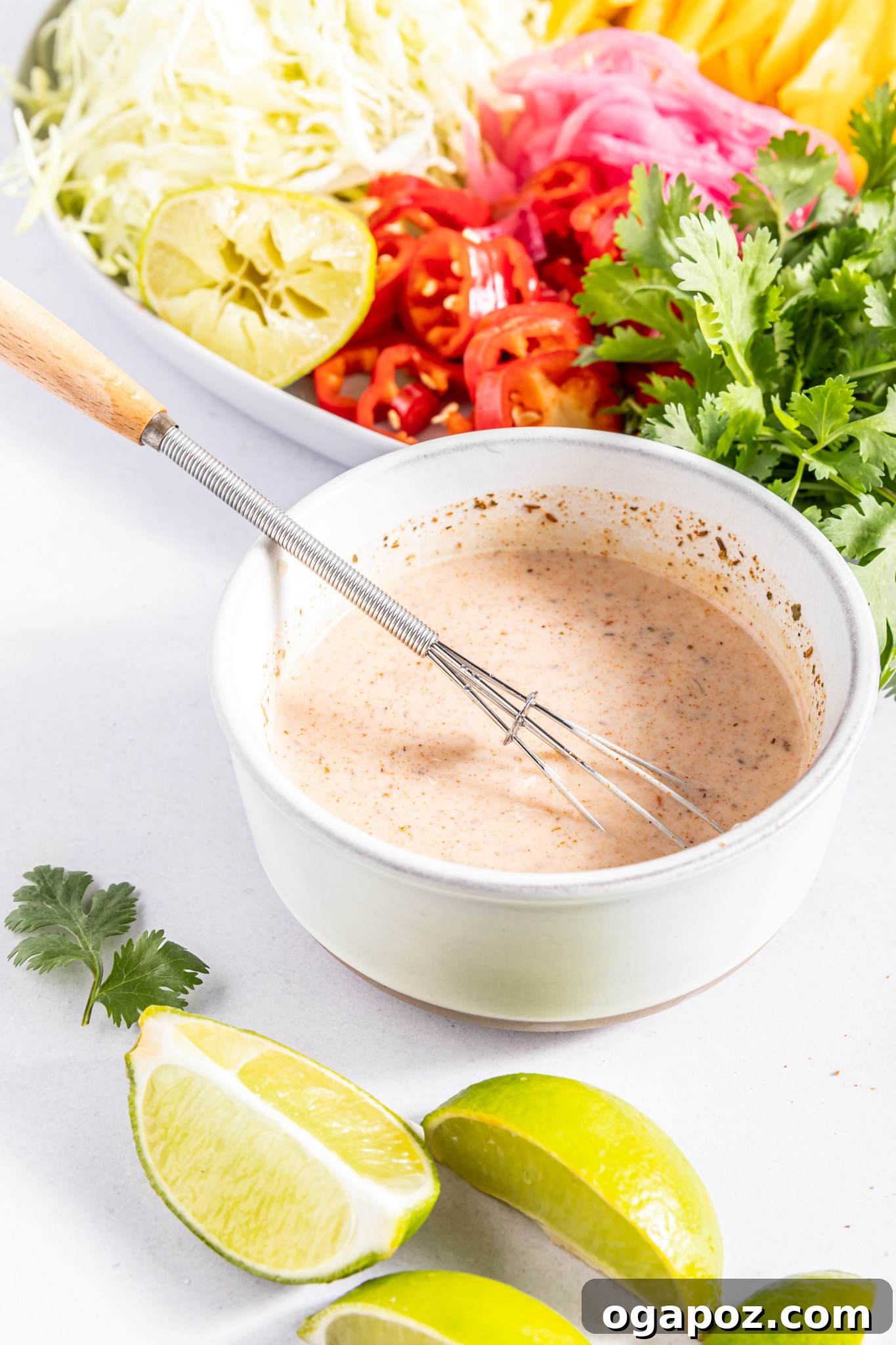 Easy Caribbean Coleslaw Recipe in a serving bowl with fresh cilantro.