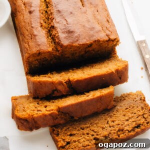 Pumpkin Banana Bread sliced on a plate.