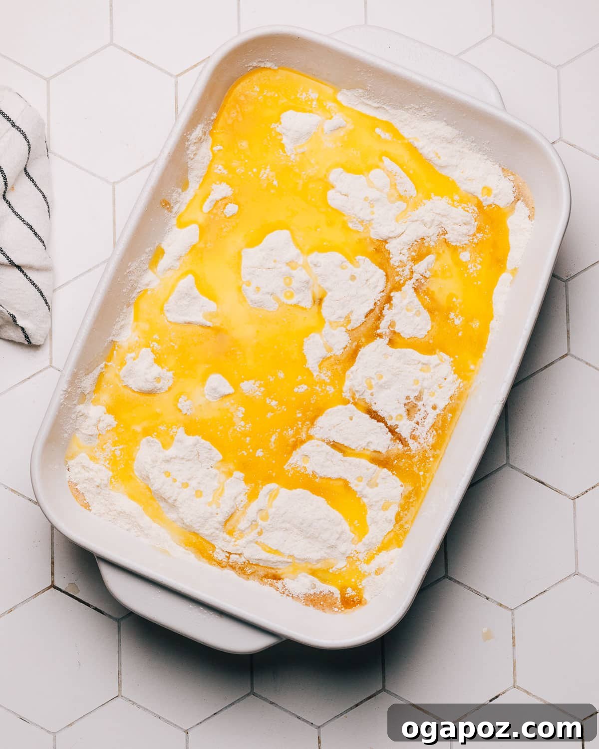 Step-by-step image showing the baked Pumpkin Dump Cake, with a golden brown, crisp topping and a creamy pumpkin filling visible.