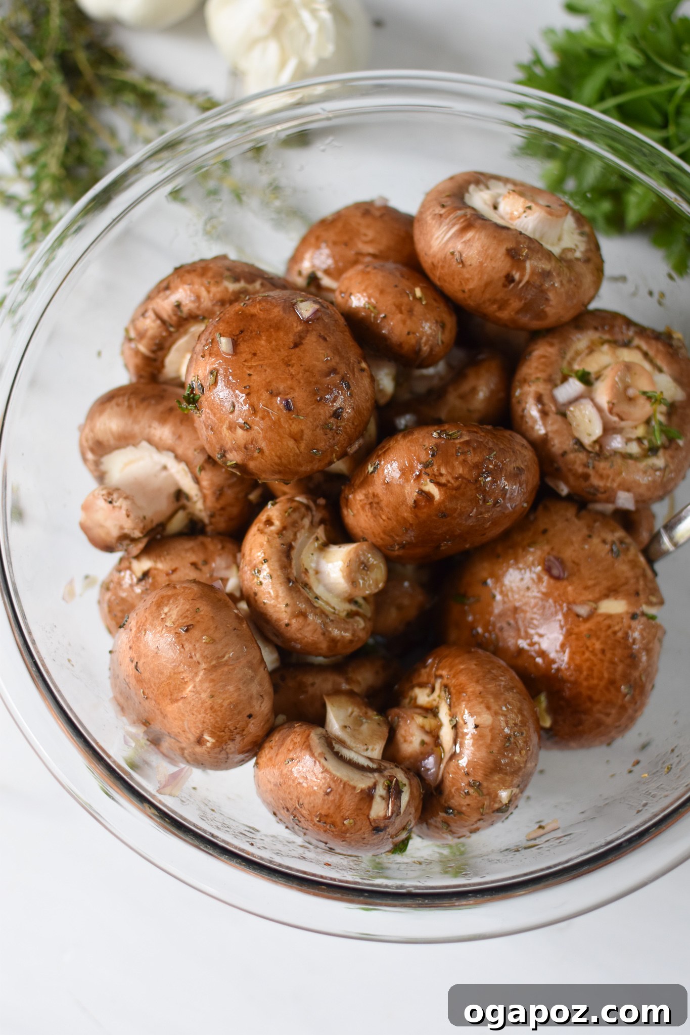 Caramelized Balsamic Roasted Mushrooms 5 Roasted Balsamic Mushrooms in a clear bowl.