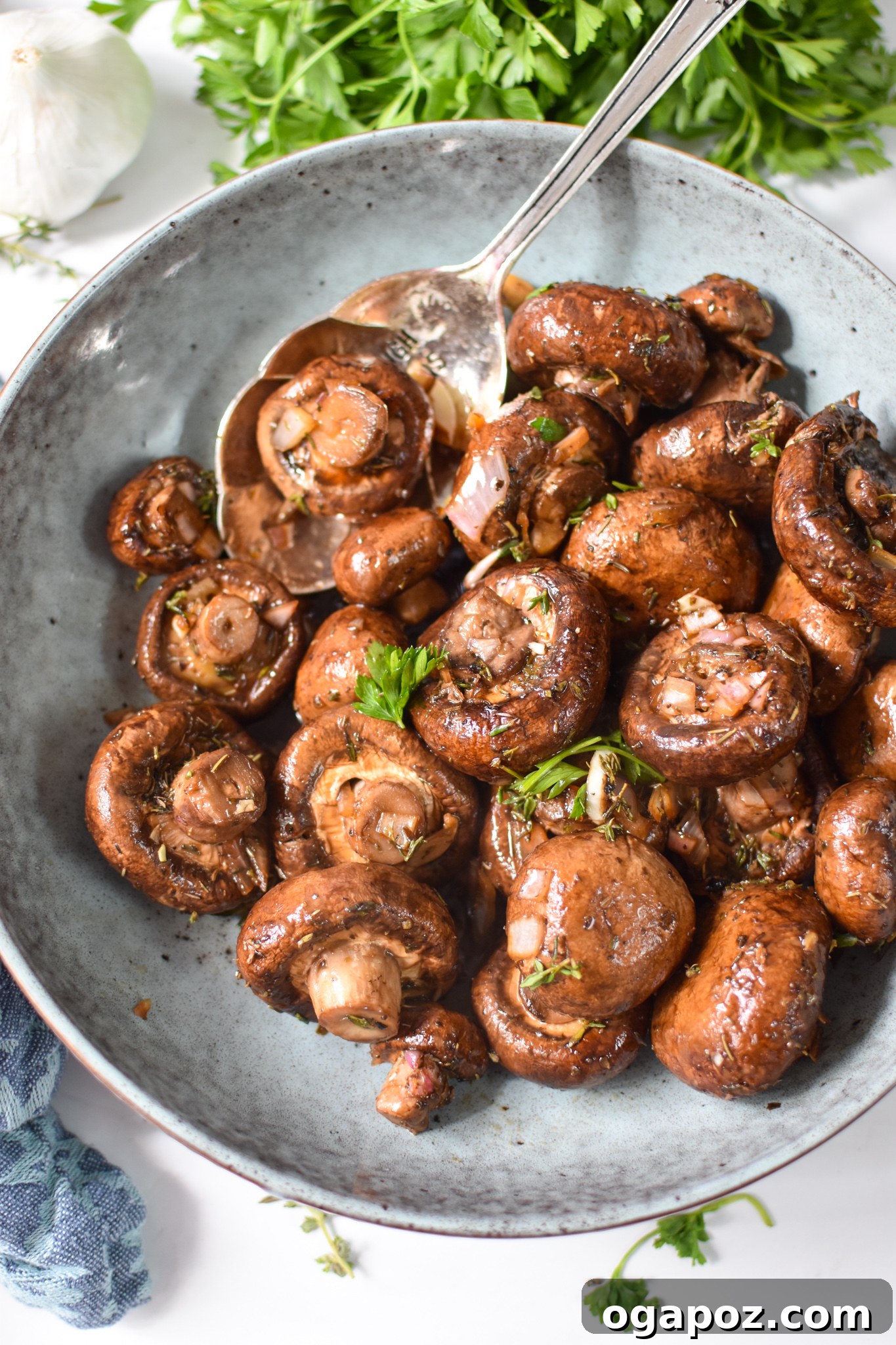 Caramelized Balsamic Roasted Mushrooms 8 Roasted Balsamic Mushrooms in a blue bowl.