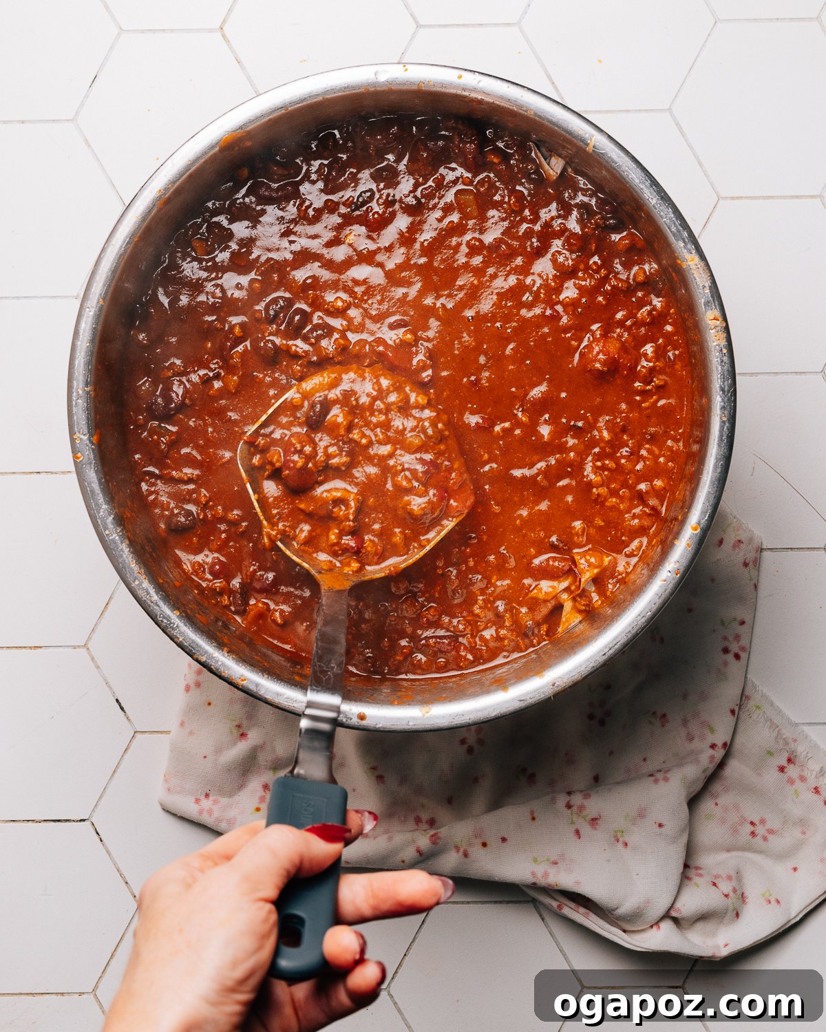 Hearty Instant Pot Turkey Chili 4 A ladle serving Instant Pot turkey chili into a bowl, showcasing its rich texture and color.