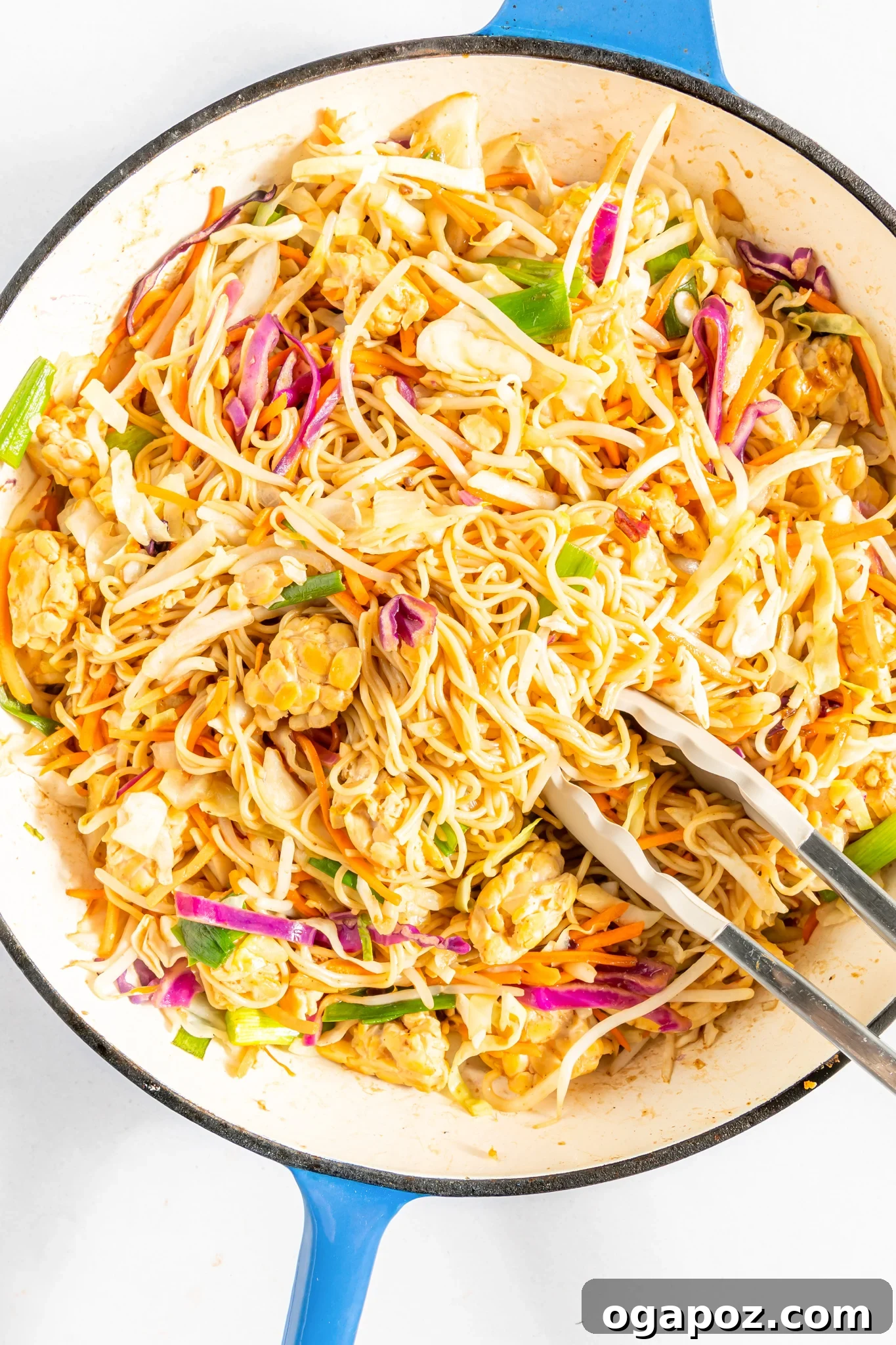 Simple Garden Noodle Stir-fry 7 Easy Vegetable Chow Mein being tossed with tongs.