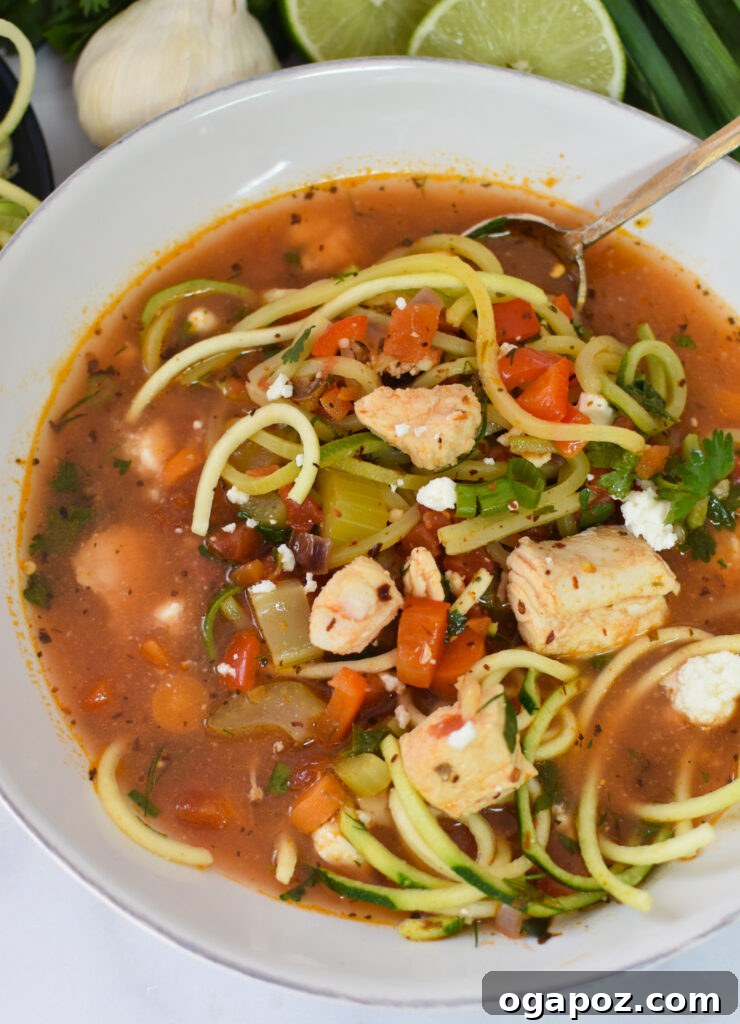 Rustic Mediterranean Fish Soup 4 Mediterranean Fish Soup served in a bowl with zucchini noodles and fresh herbs.