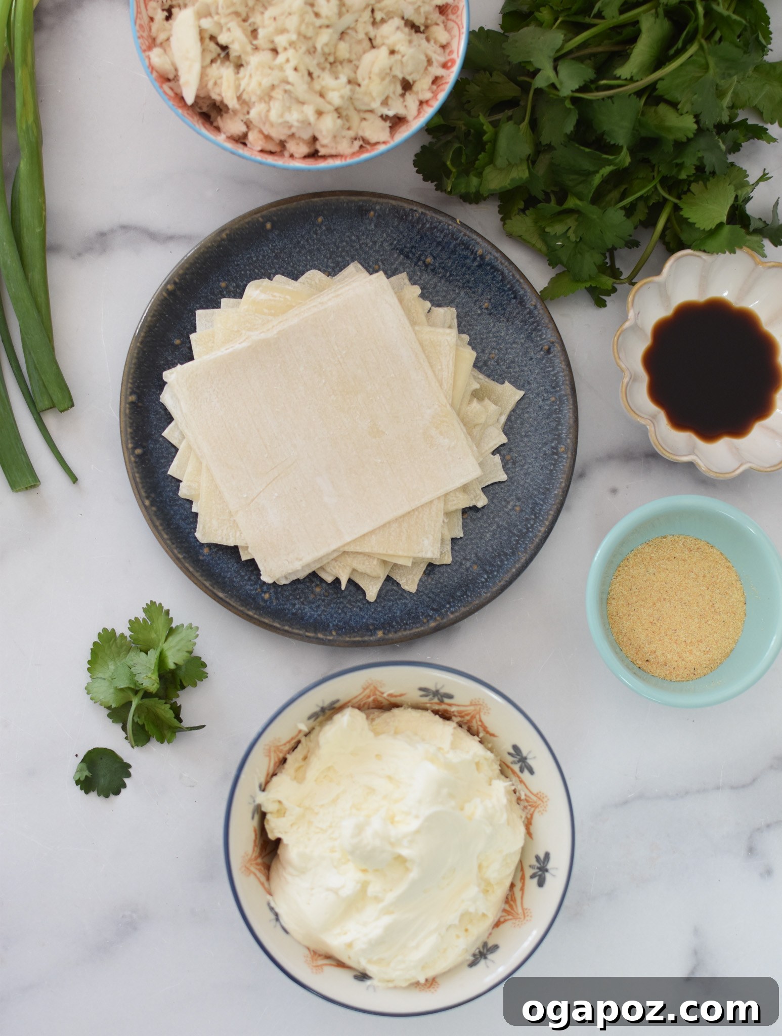 Crispy Air Fryer Crab Rangoon 3 All the ingredients for Air Fryer Crab Rangoon laid out on a kitchen counter.