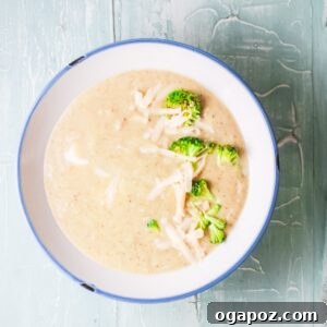 A close-up of a serving of Instant Pot Broccoli Soup, showcasing its creamy texture and rich color.