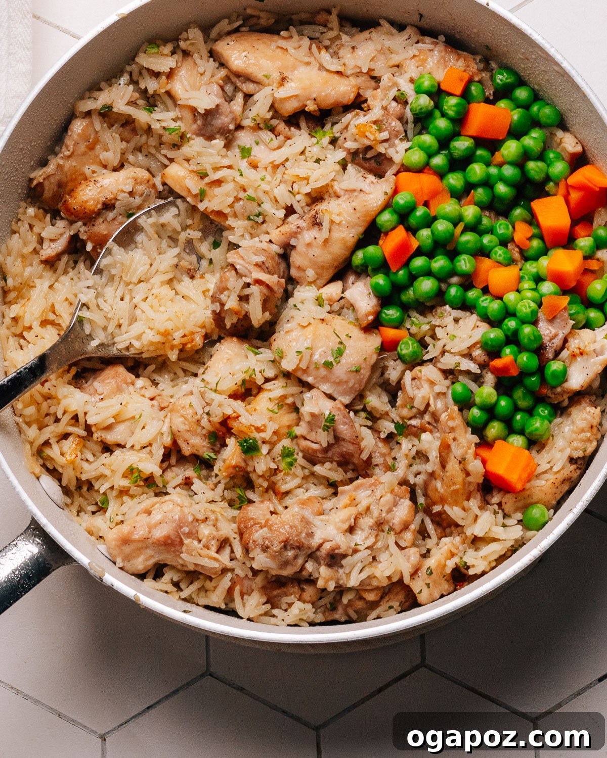 Effortless Chicken and Rice Delight 11 A close-up shot of the finished chicken and rice in a skillet, garnished with fresh parsley.