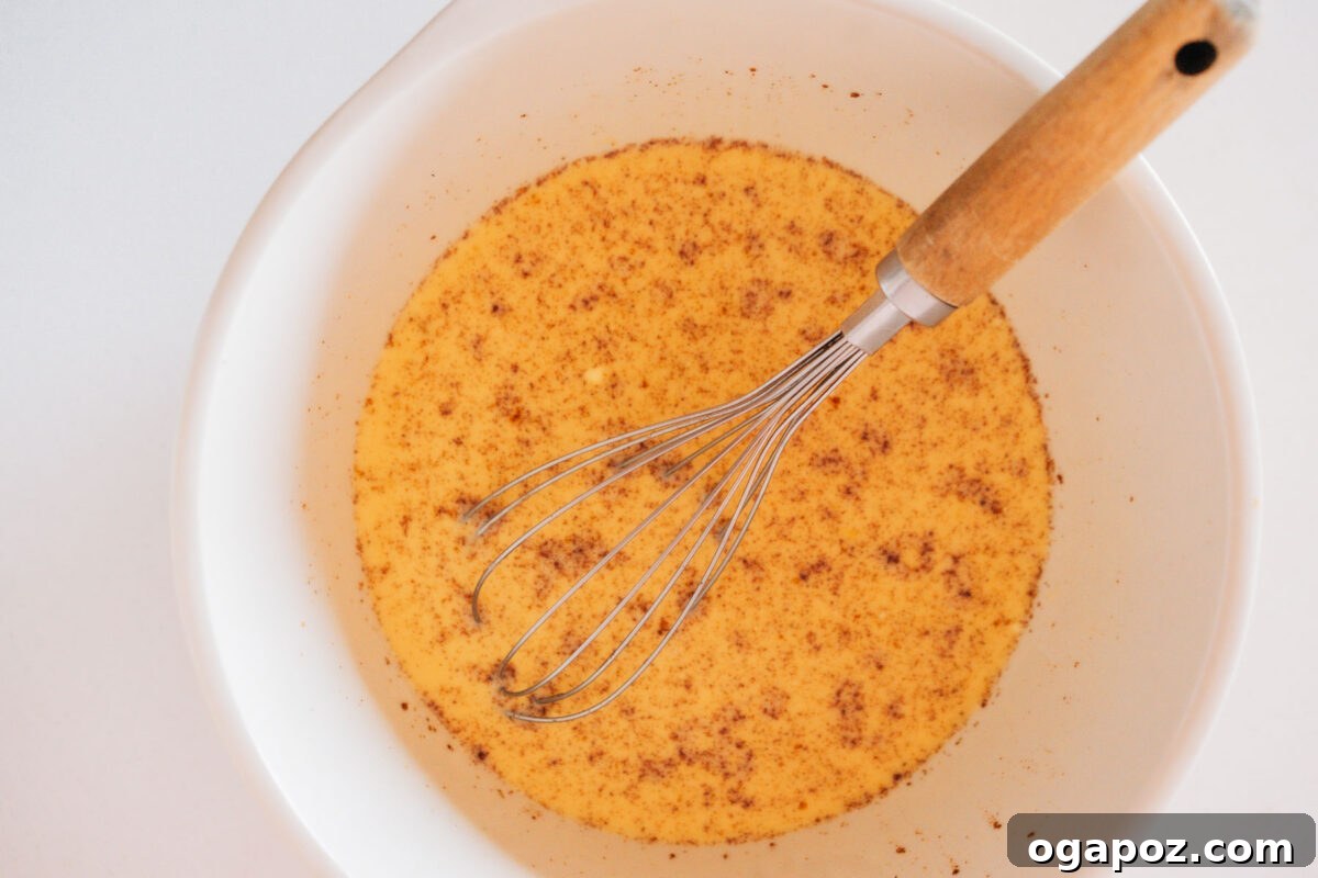 Sweet Morning French Toast Bake 4 Step 1: Whisking together the French Toast Bake custard ingredients in a large bowl.