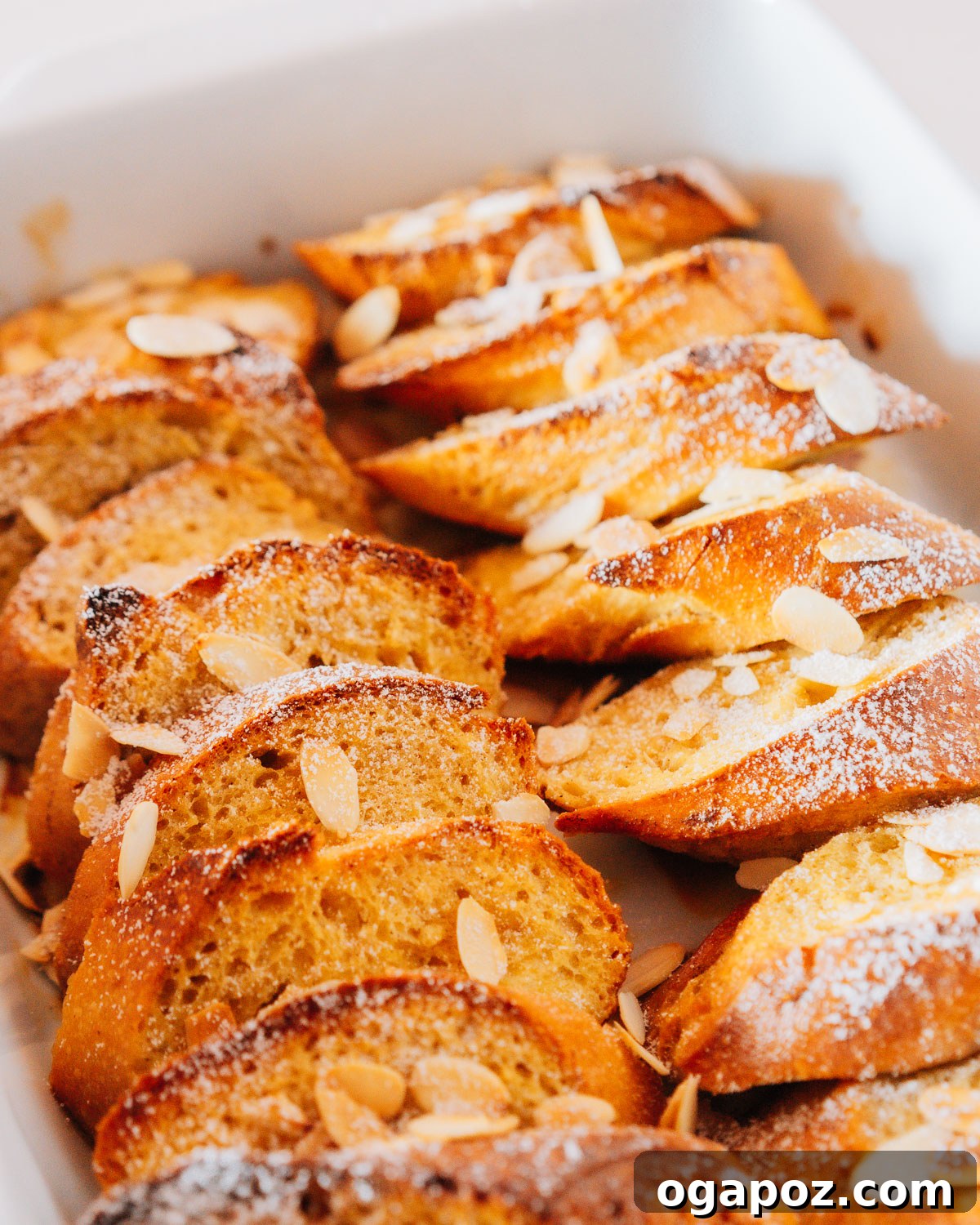 Sweet Morning French Toast Bake 6 The finished French Toast Bake, elegantly served with fresh berries, maple syrup, and powdered sugar.