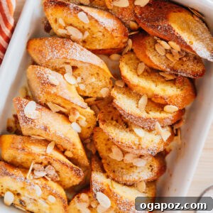 French Toast Bake with berries and powdered sugar.