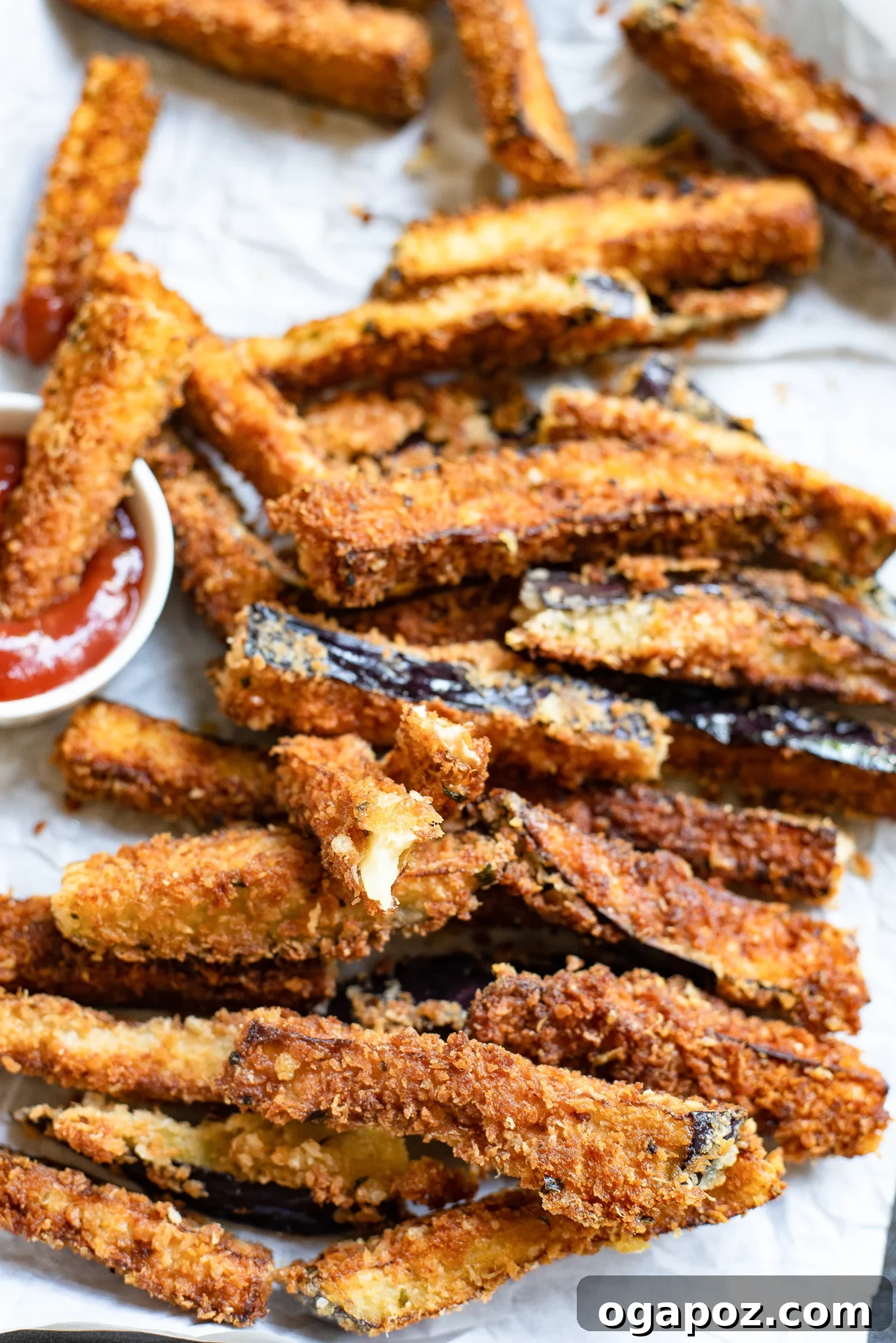 Irresistible Air Fryer Eggplant Fries 4 Air Fryer Eggplant Fries Recipe served in dipping sauce, showcasing crispy texture.