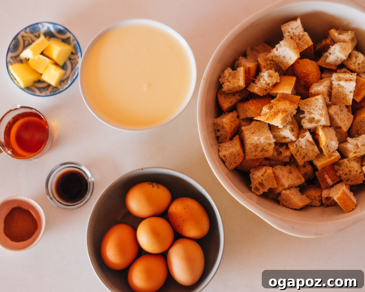 Easy Overnight French Toast Bake 3 A selection of fresh ingredients including eggs, milk, bread, cinnamon, and vanilla extract for French Toast Casserole.