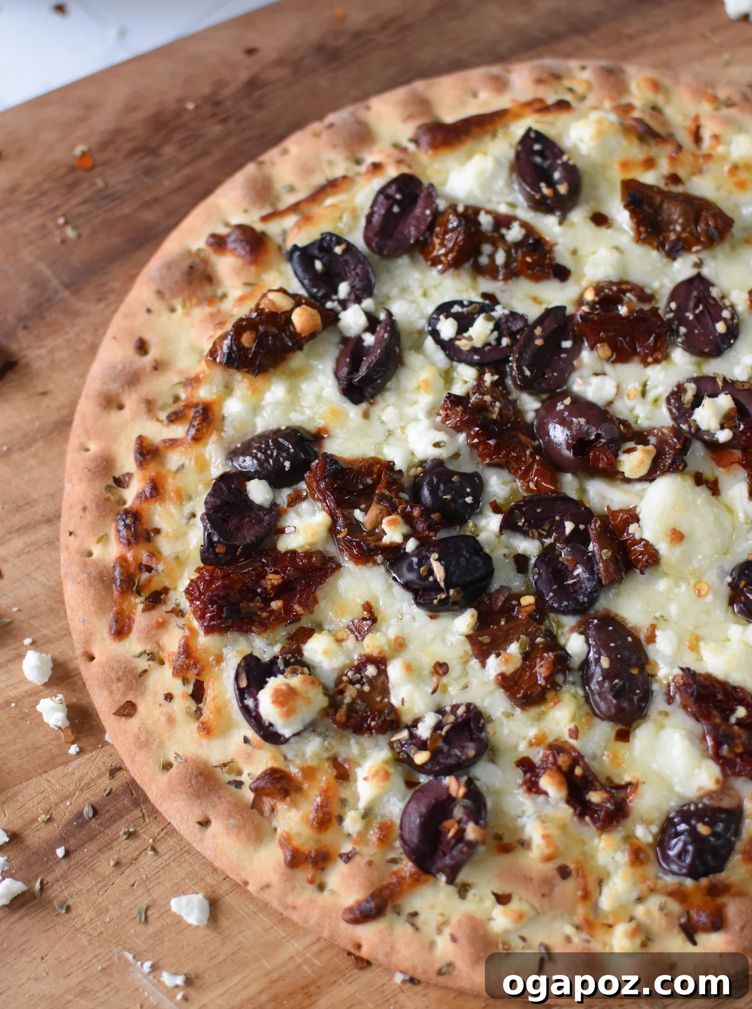 Aegean Delight Pizza 6 Baked Greek Pizza, golden and bubbly, before adding the fresh salad topping.