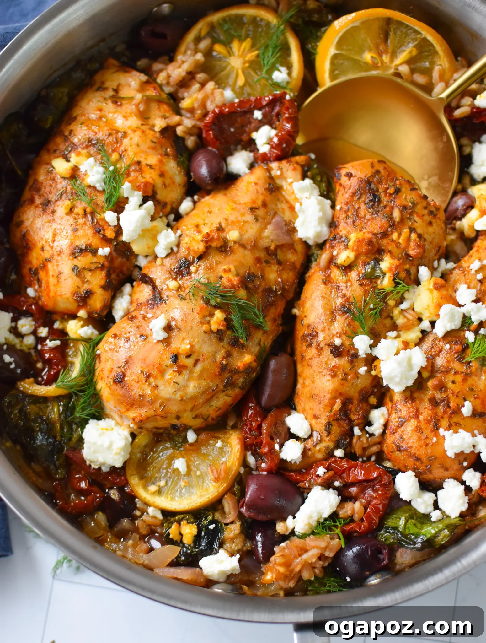 Tuscan Chicken Farro Bake 2 Sun-dried Tomato Farro Chicken Bake with a gold spoon