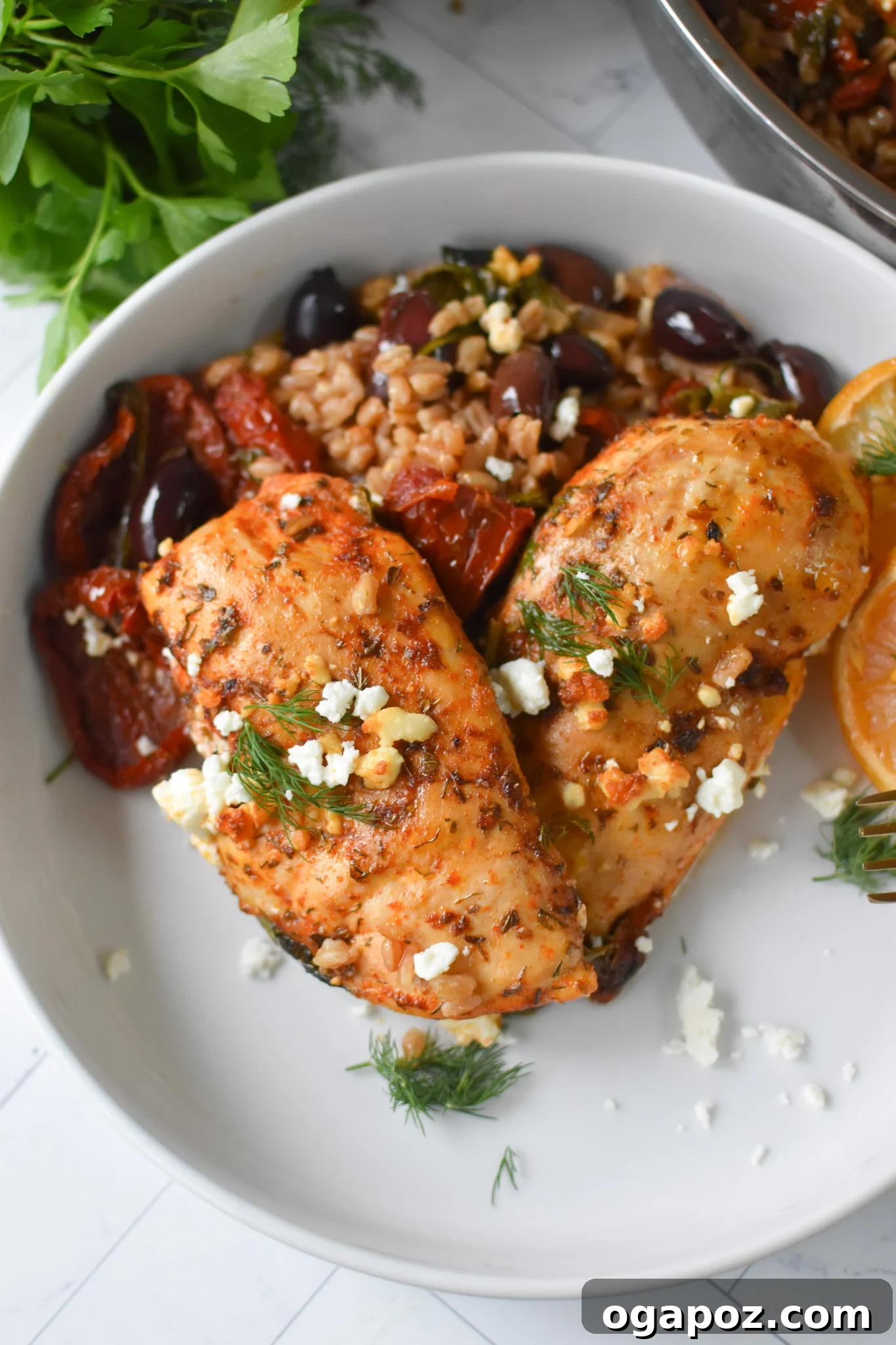 Tuscan Chicken Farro Bake 4 Sun-dried Tomato Farro Chicken Bake in a white bowl.