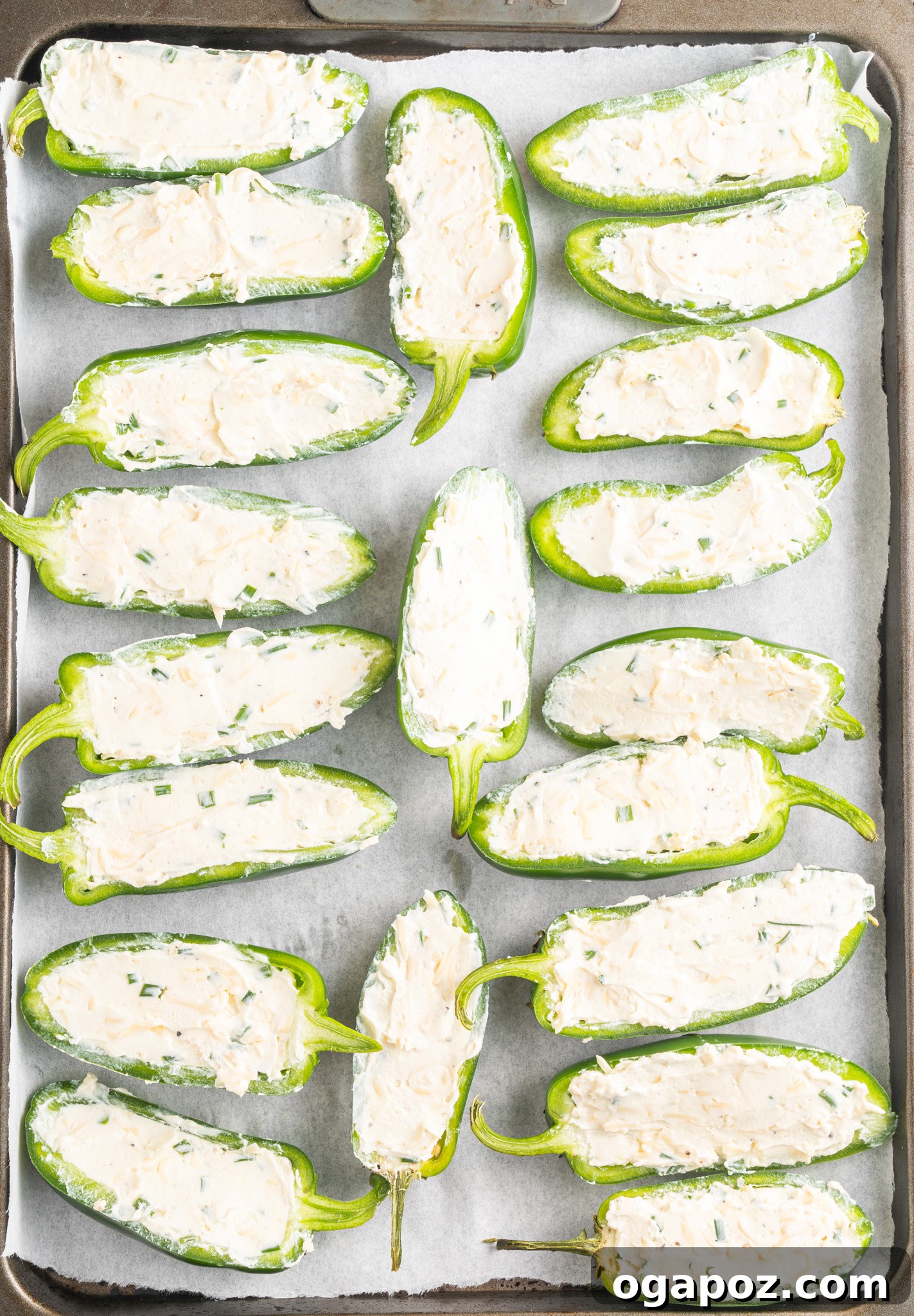 Bacon-Wrapped Jalapeño Bombs 7 Jalapeño halves carefully filled with the creamy cheese mixture on a baking sheet.