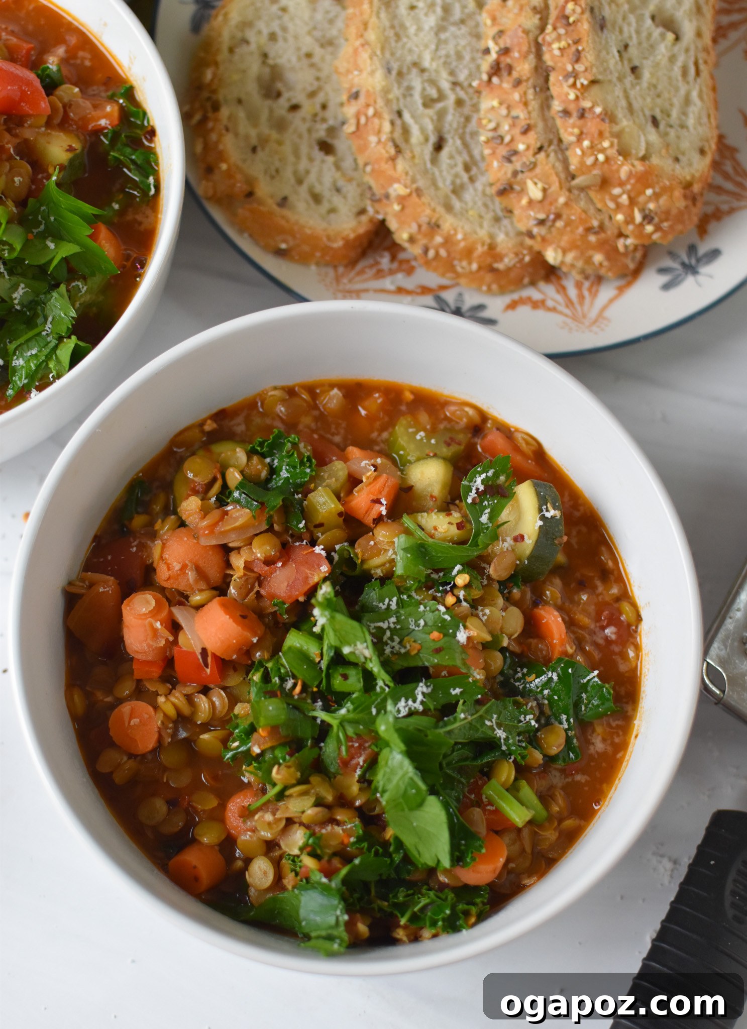 Hearty Tuscan Lentil Stew 7 A bowl of Italian Style Lentil Soup served with a generous slice of crusty bread, perfect for dipping.