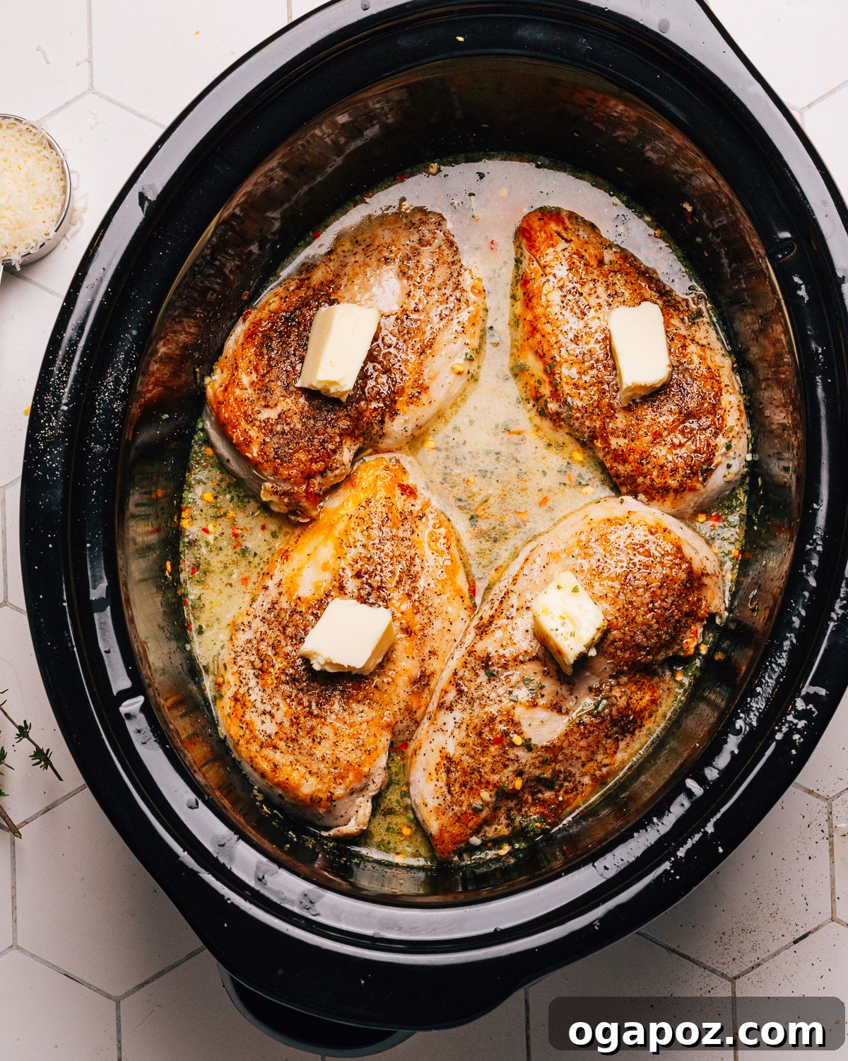 Lemony Slow Cooker Chicken 5 Whisking chicken broth, lemon juice, zest, and spices in a crockpot.