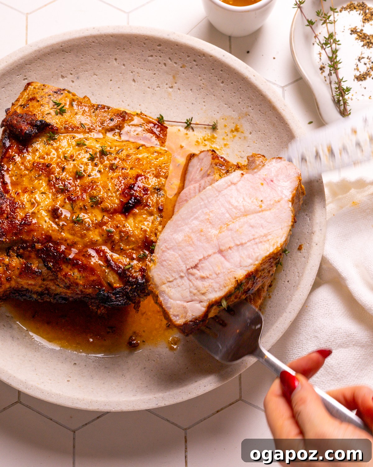 15 Trendsetting Recipes to Savor in 2025 5 A perfectly roasted pork loin, beautifully sliced and presented on a platter with roasted vegetables, showcasing its juicy interior and delicious golden-brown crust.