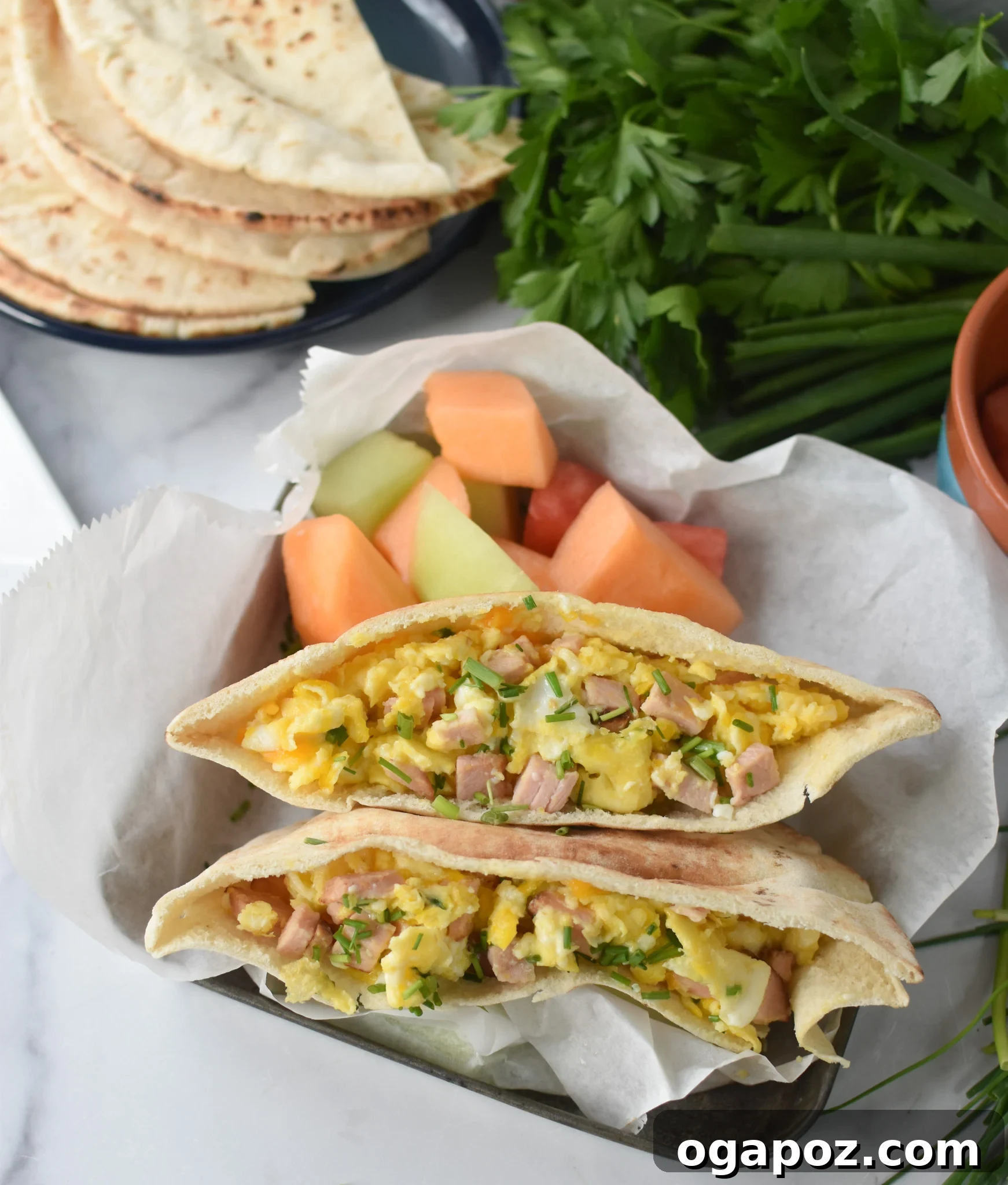 Savory Morning Pitas 2 Delicious Breakfast Pita Recipe with fresh fruit on the side, showcasing a healthy and vibrant meal.