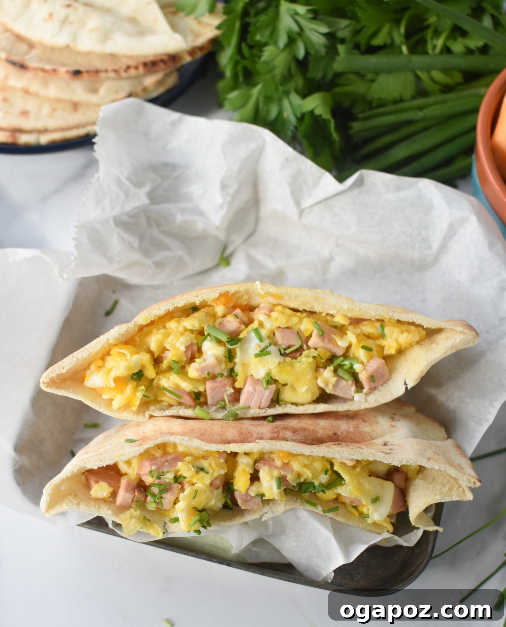 Savory Morning Pitas 6 Breakfast Pita Recipe packed neatly into a tin, perfect for meal prep or taking on the go.