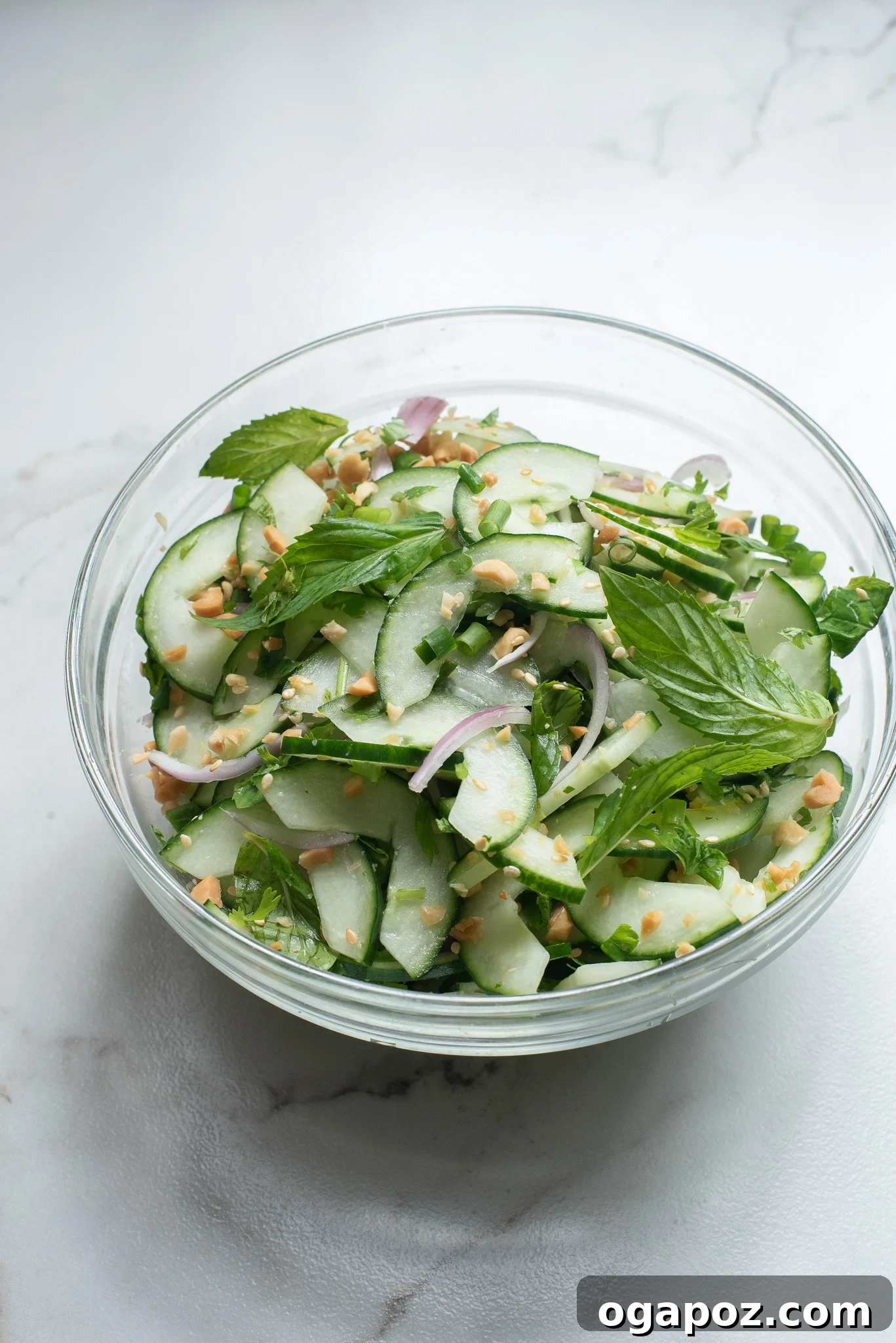 Zesty Thai Cucumber Delight 7 The finished Thai Cucumber Salad, dressed and ready to enjoy in a glass bowl.