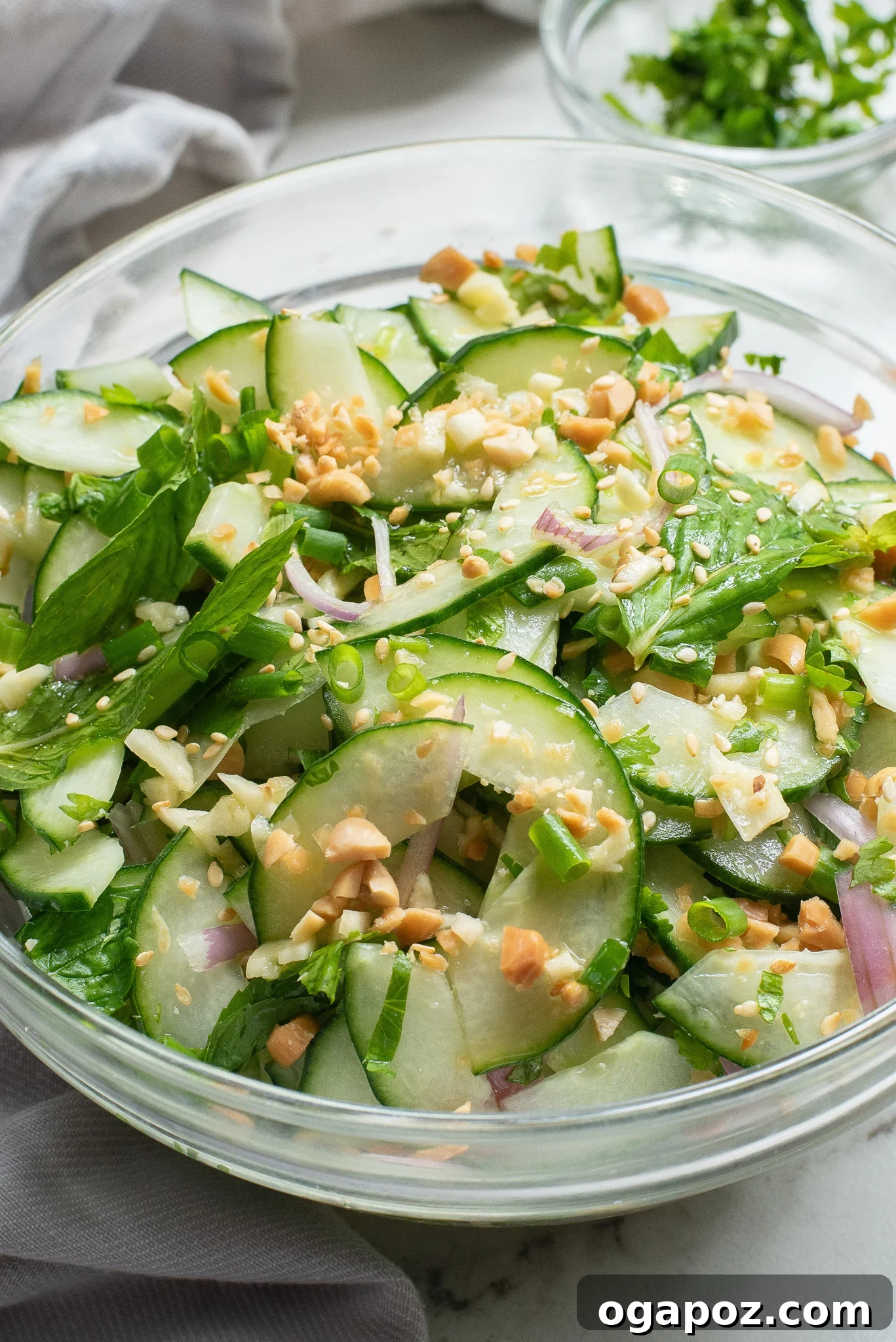 Zesty Thai Cucumber Delight 8 Close-up of Thai Cucumber Salad, highlighting the chopped peanuts and fresh herbs.