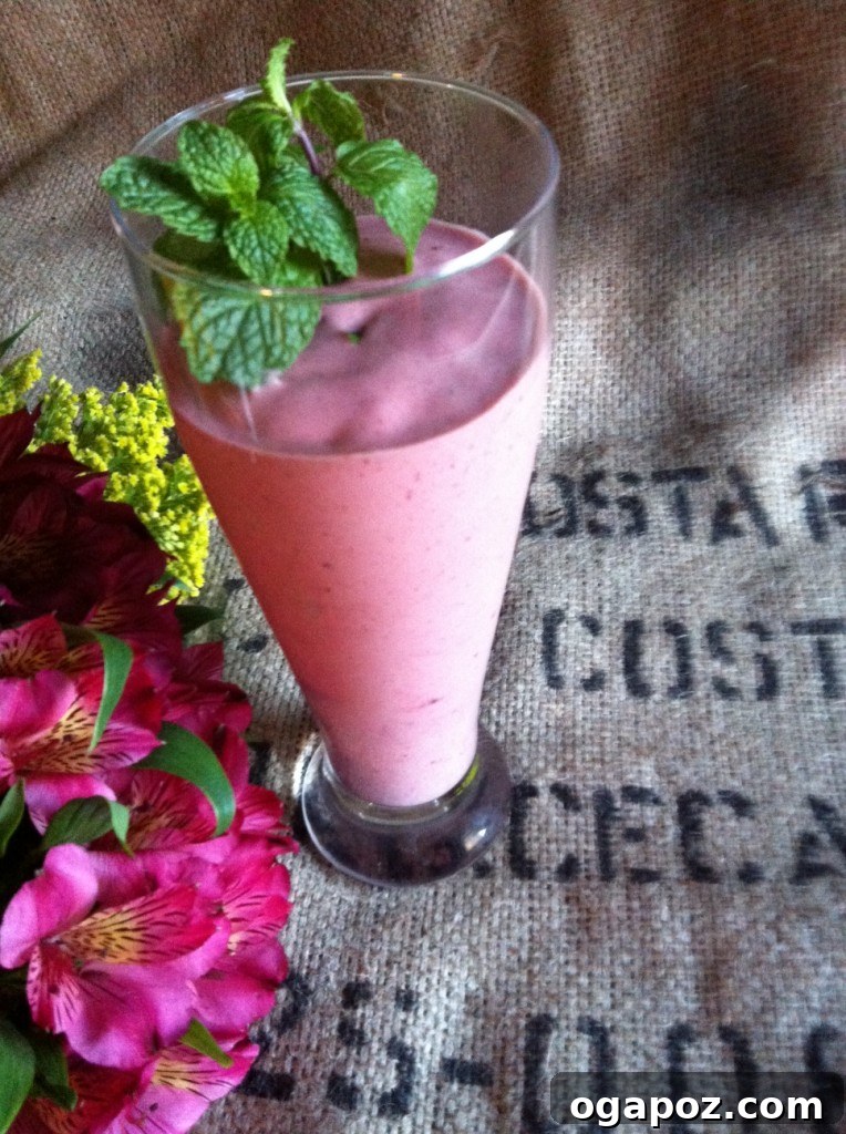 Close-up of a refreshing berry smoothie, garnished with fresh berries