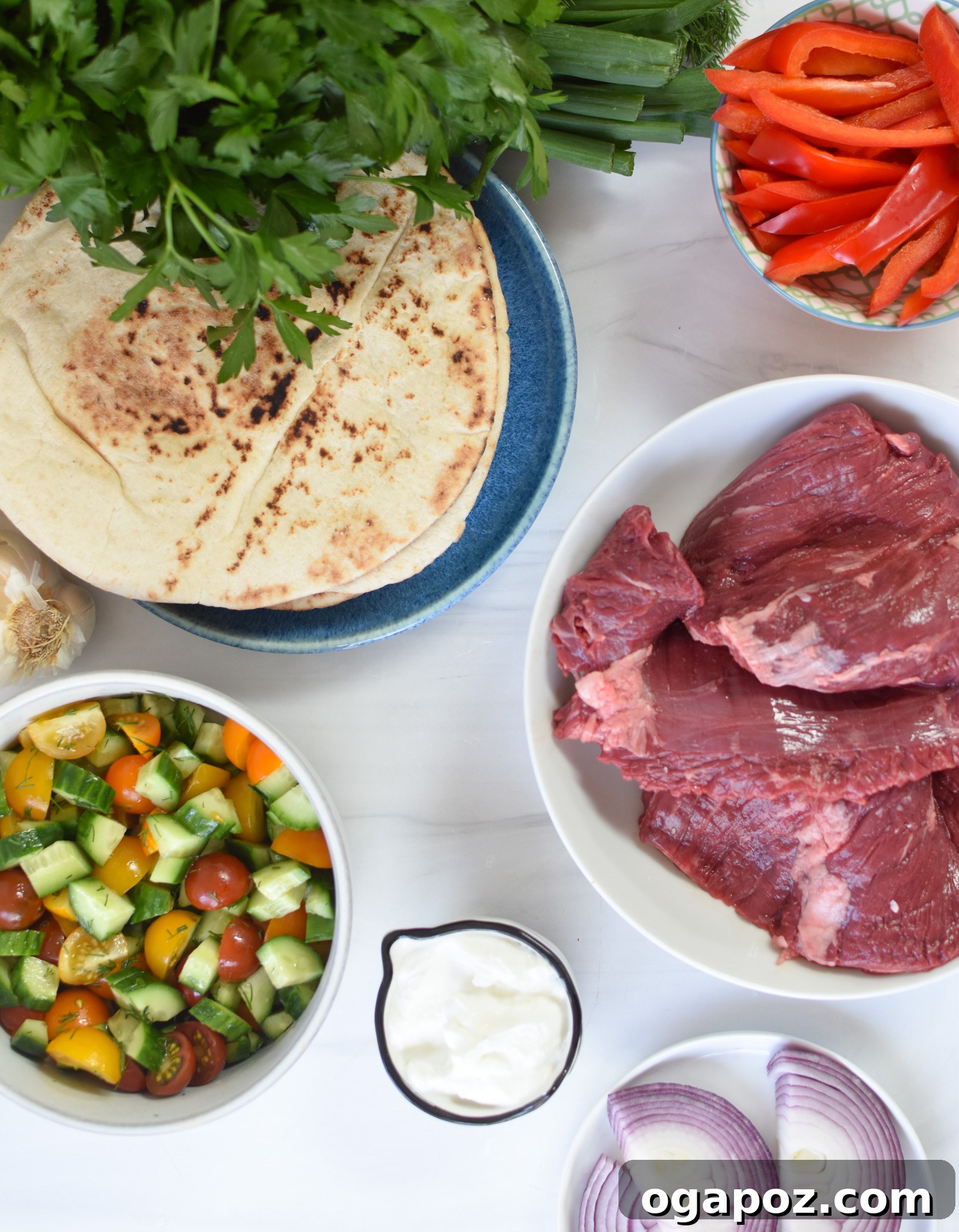 Quick Beef Gyro Wraps 6 All ingredients for Easy Beef Gyros laid out on a wooden surface