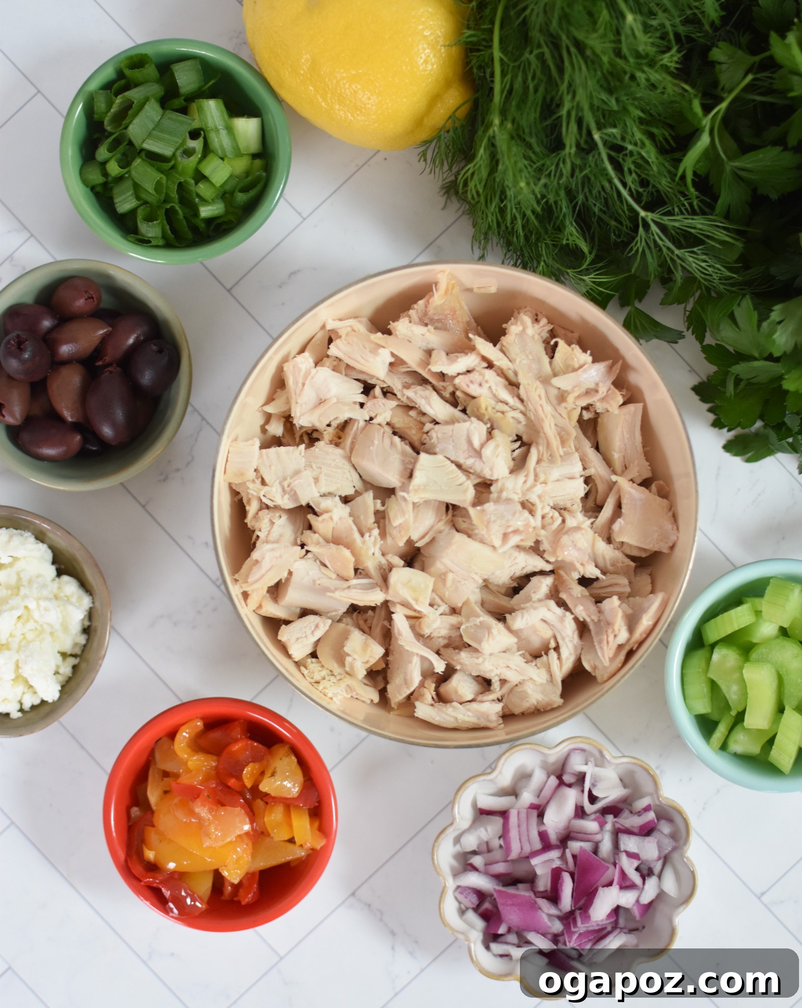 Vibrant Mediterranean Chicken Salad 6 A selection of fresh ingredients for Mediterranean Chicken Salad, including chicken, vegetables, and dressing components.