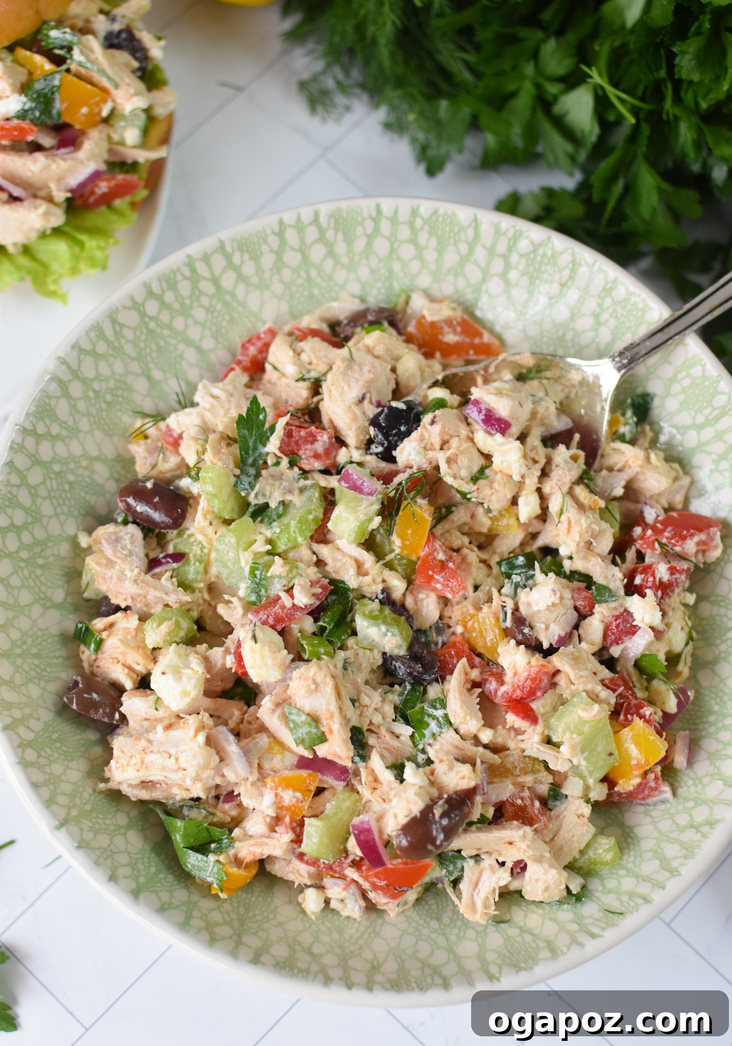 Vibrant Mediterranean Chicken Salad 8 Healthy Mediterranean Chicken Salad thoughtfully plated in an elegant green bowl.