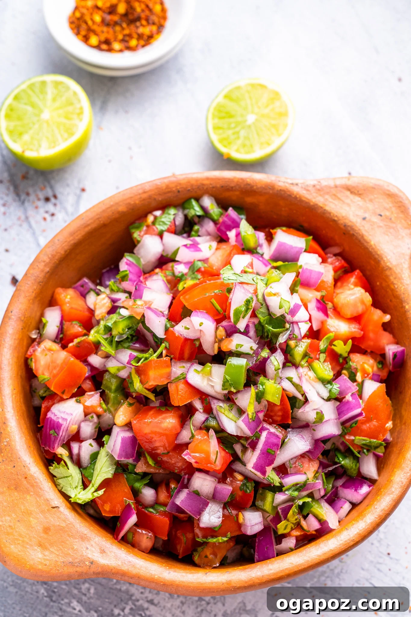 Vibrant Homemade Pico de Gallo 2 Homemade Pico de Gallo in a beautiful tan colored bowl, showcasing its vibrant freshness.
