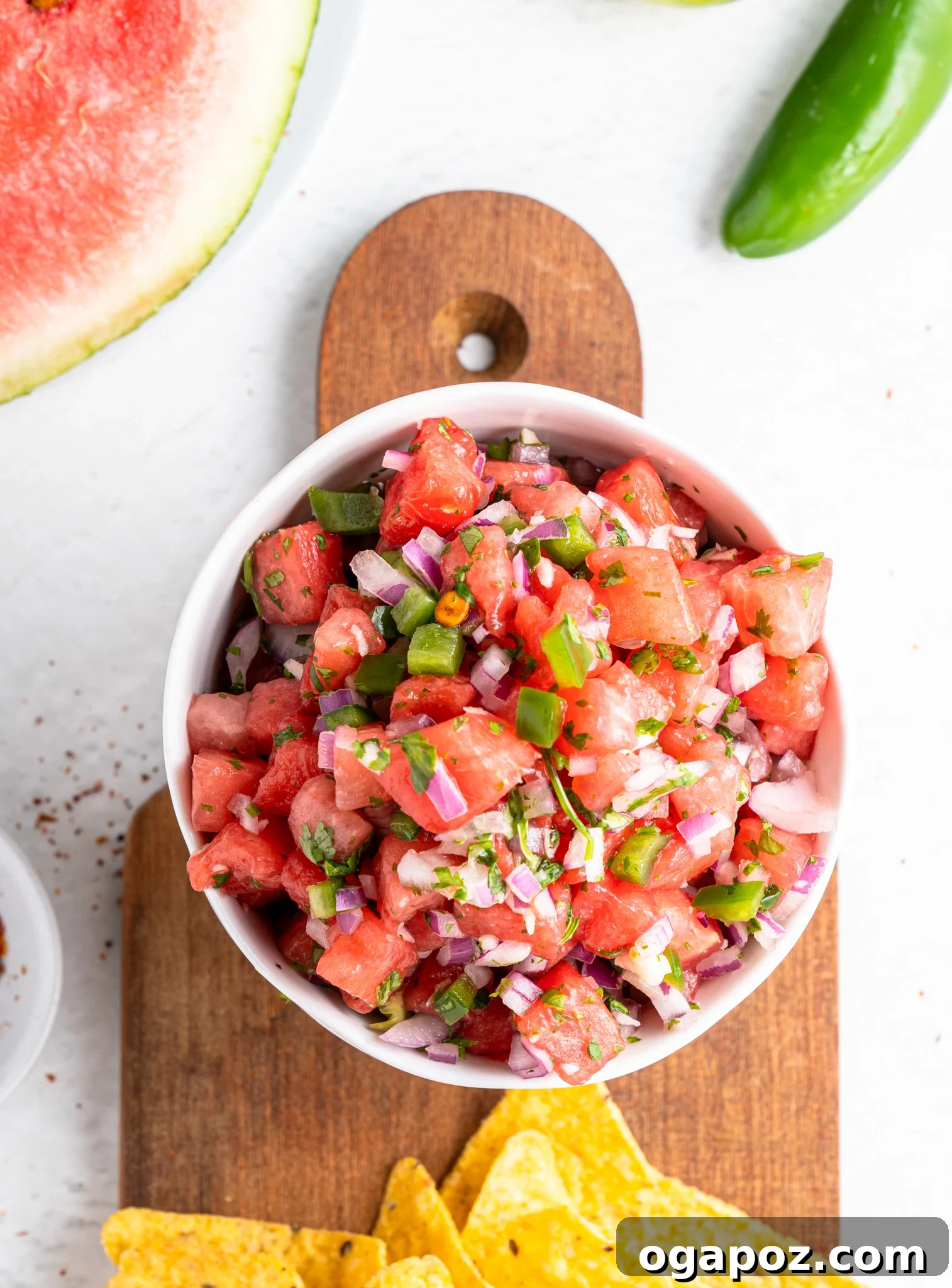 Summer Watermelon Salsa 5 Easy Watermelon Salsa being mixed on a cutting board, showing diced ingredients.