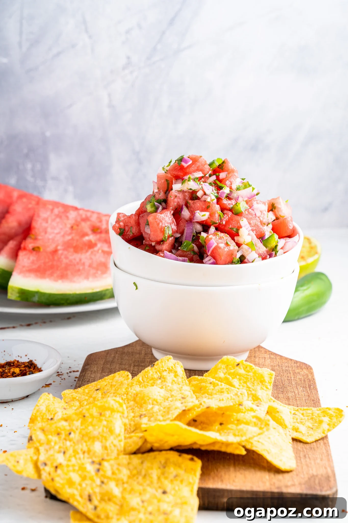 Summer Watermelon Salsa 6 Easy Watermelon Salsa served in a white bowl with tortilla chips around it.