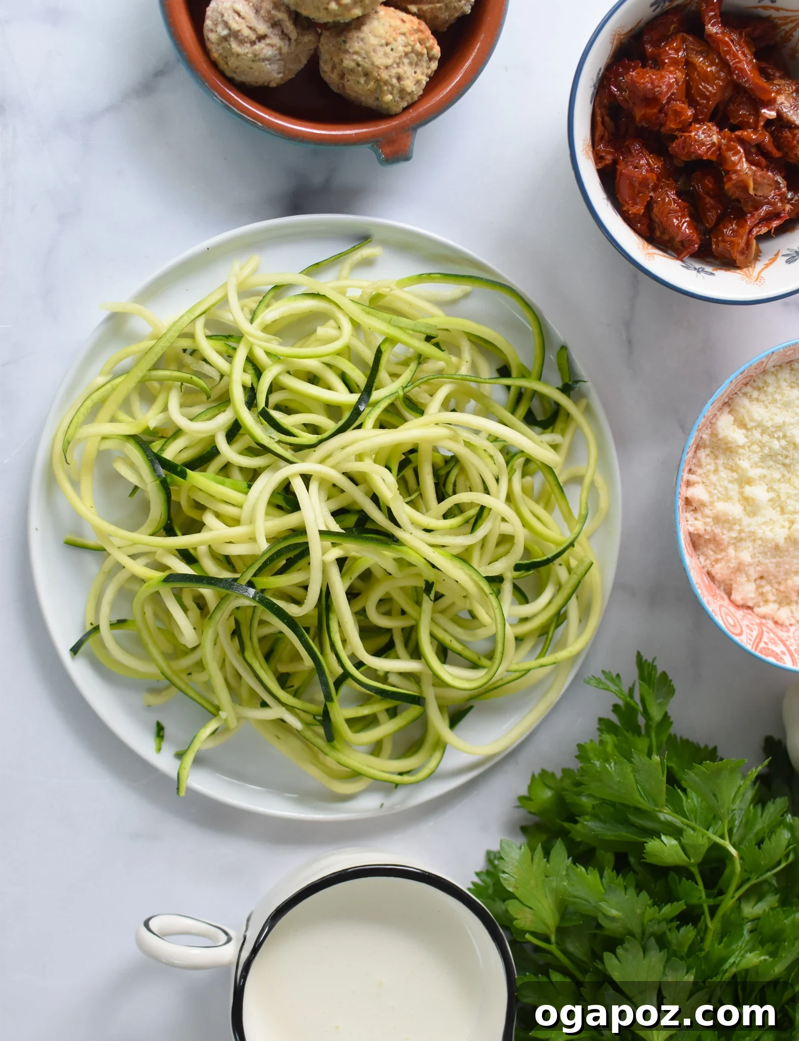 Creamy Zucchini Noodle Alfredo 3 Alfredo Zoodles Recipe ingredients laid out on a table.
