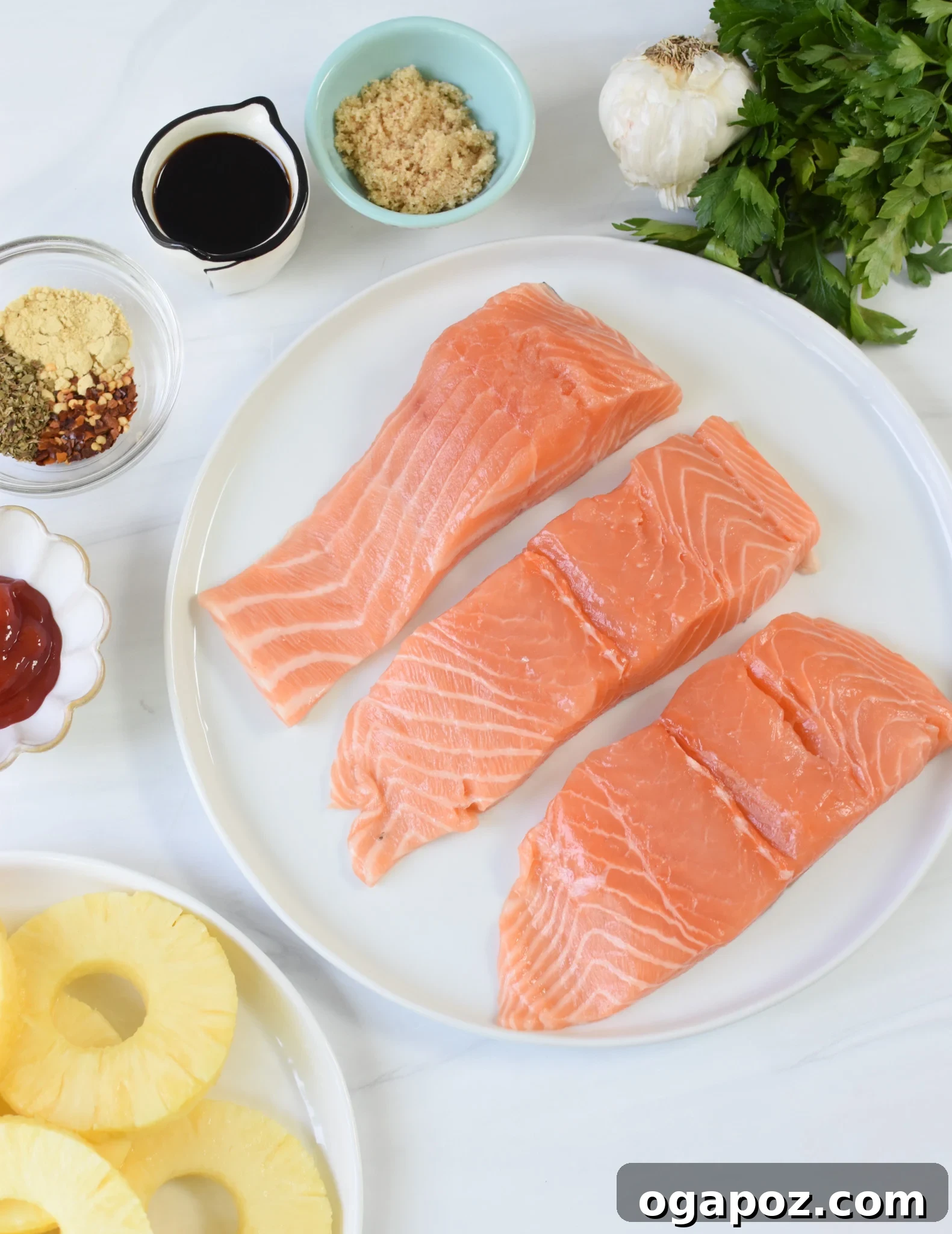 Aloha Grilled Salmon 6 A vibrant display of fresh Hawaiian Grilled Salmon ingredients laid out on a wooden board.