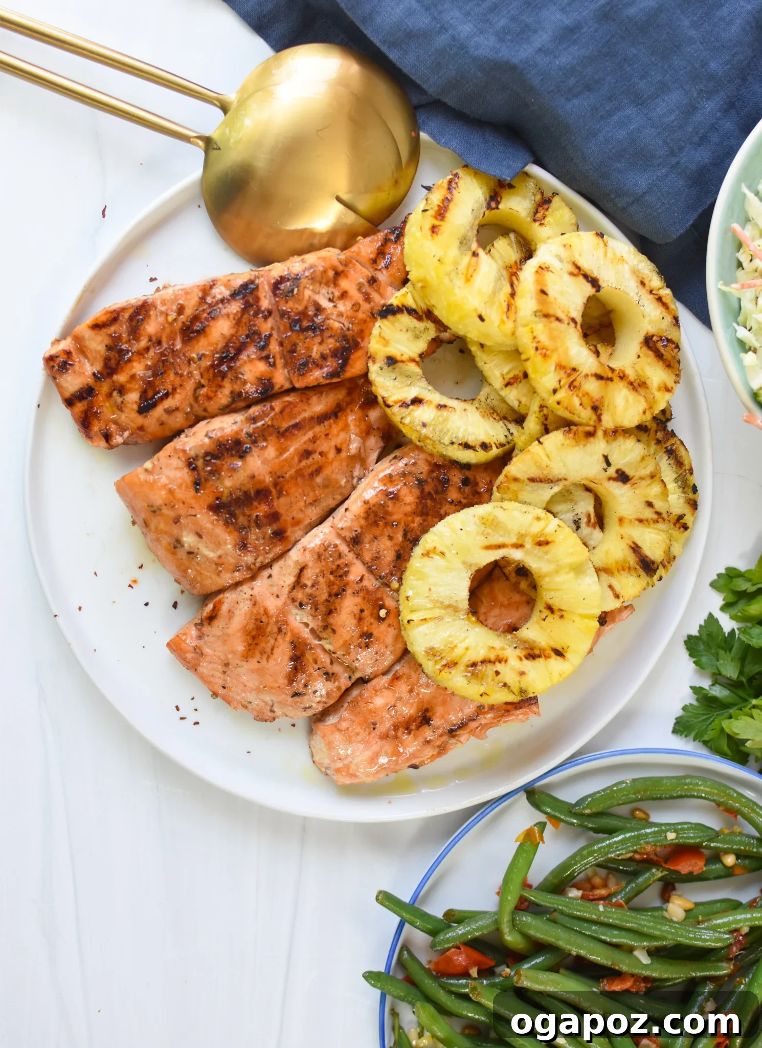 Aloha Grilled Salmon 10 Hawaiian Grilled Salmon served with a side of fresh green beans, ready for a healthy meal.