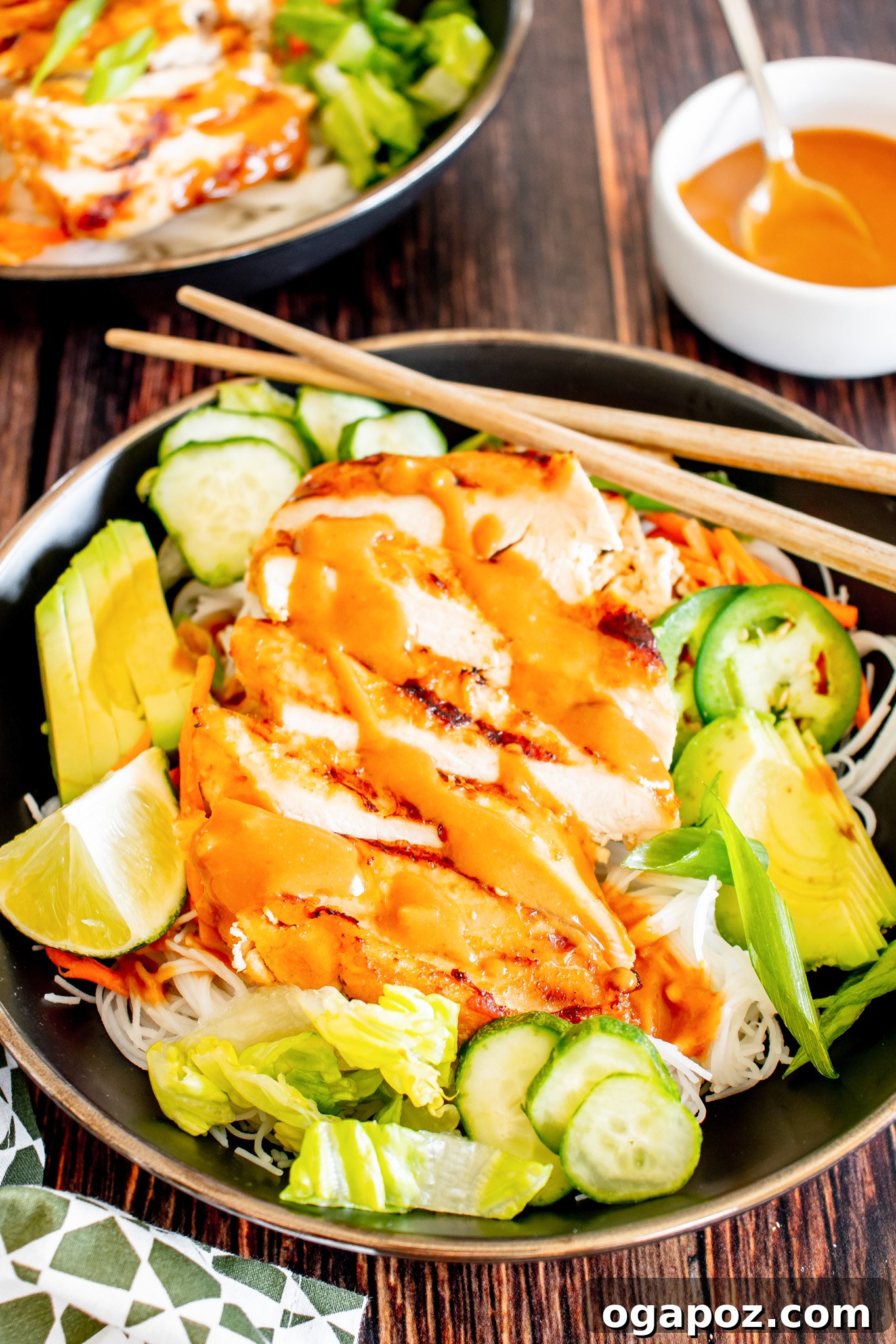 Vibrant Thai Chicken Noodle Salad 12 Fresh lime wedges artfully arranged around a bowl of Thai Chicken Noodle Salad, ready to be squeezed.