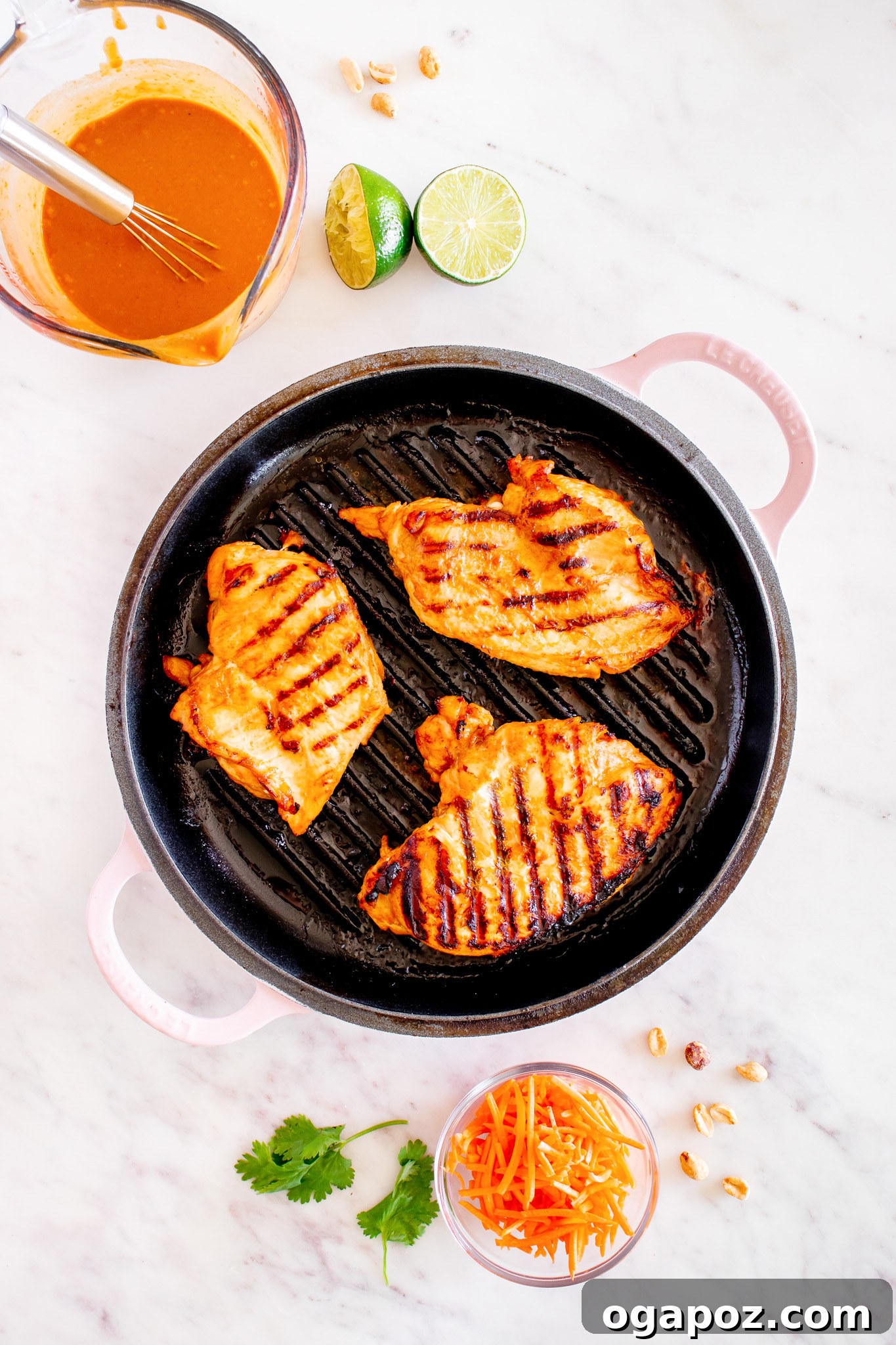 Vibrant Thai Chicken Noodle Salad 10 Perfectly grilled chicken breast with visible grill marks, resting on a cutting board.