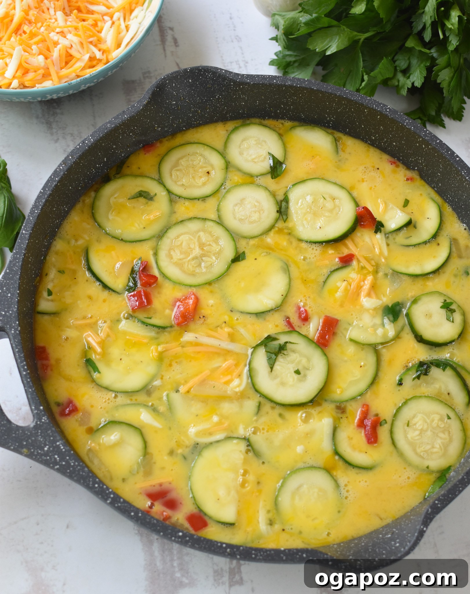 Golden Zucchini Frittata 12 Zucchini Frittata Recipe eggs and vegetables in a skillet.