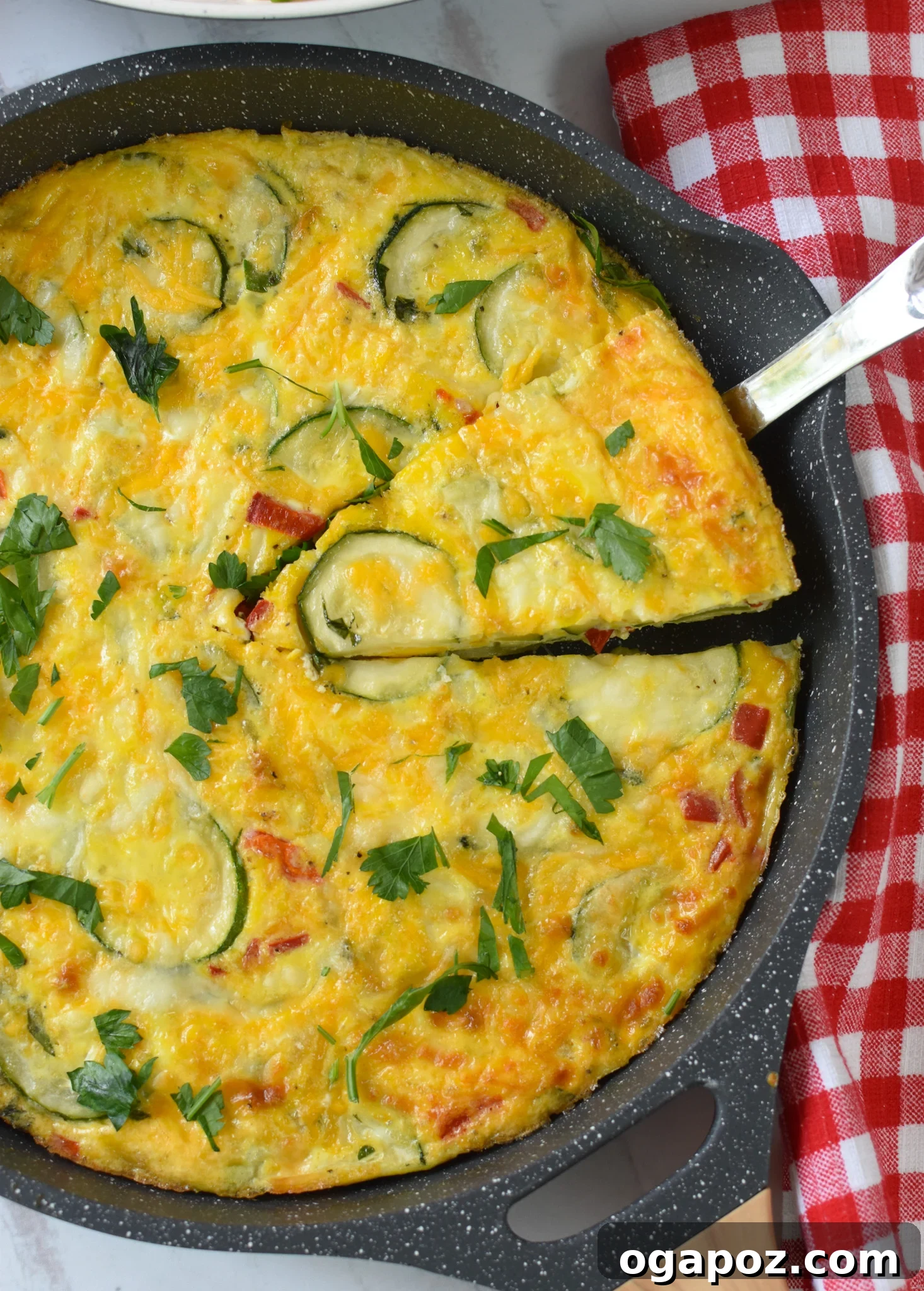 Golden Zucchini Frittata 7 Zucchini Frittata Recipe with a pie cutter.