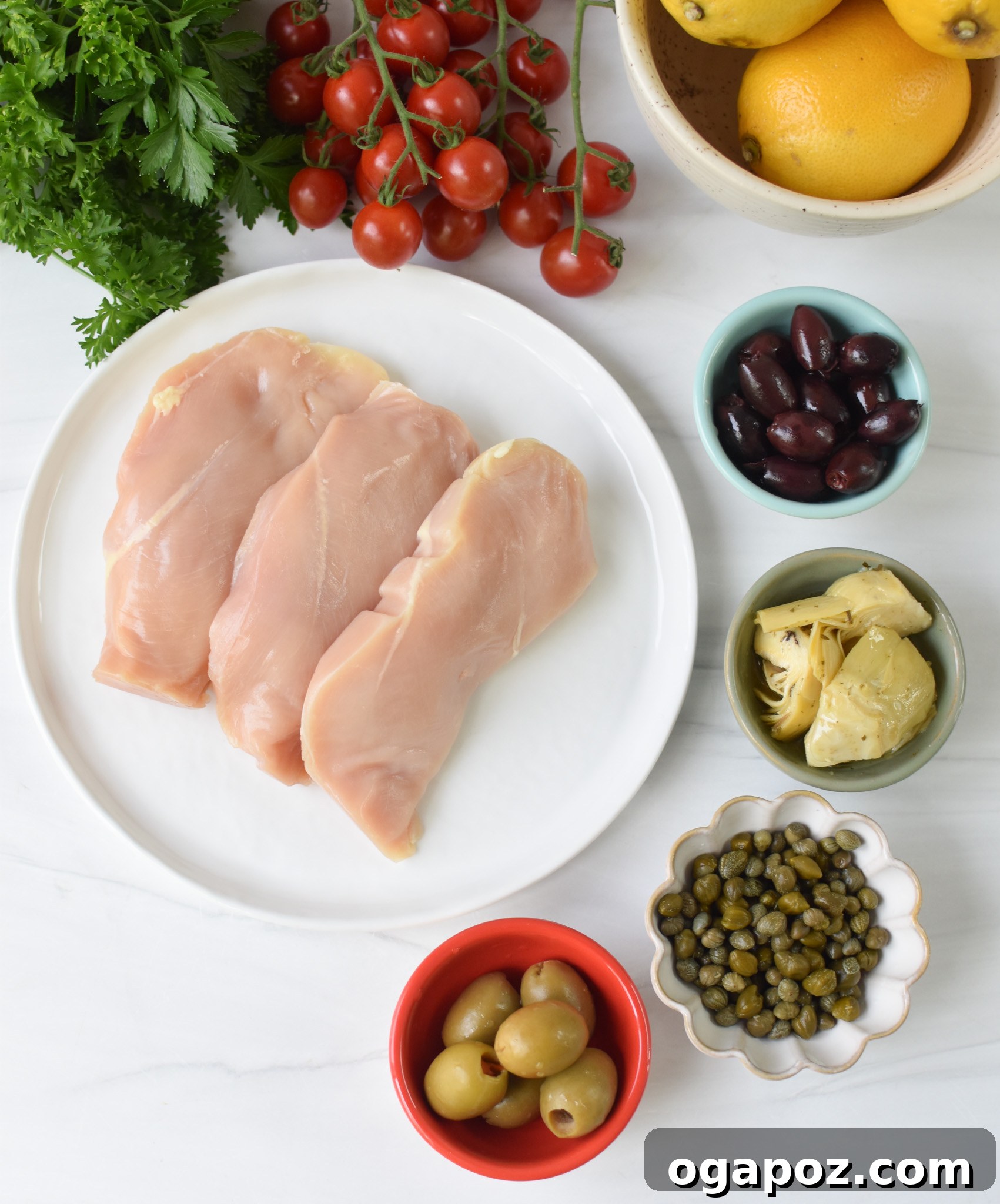 Vibrant Mediterranean Skillet Chicken 4 A collection of Mediterranean Skillet Chicken ingredients laid out on a table.