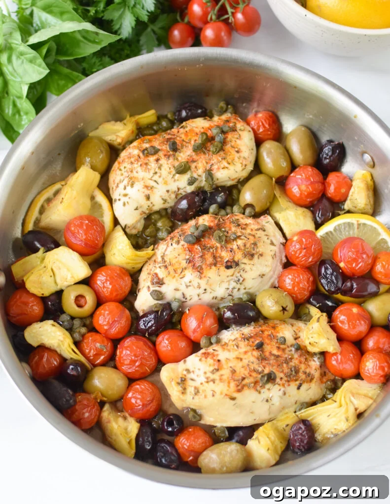 Vibrant Mediterranean Skillet Chicken 6 Seared Mediterranean Skillet Chicken in a skillet, before baking.