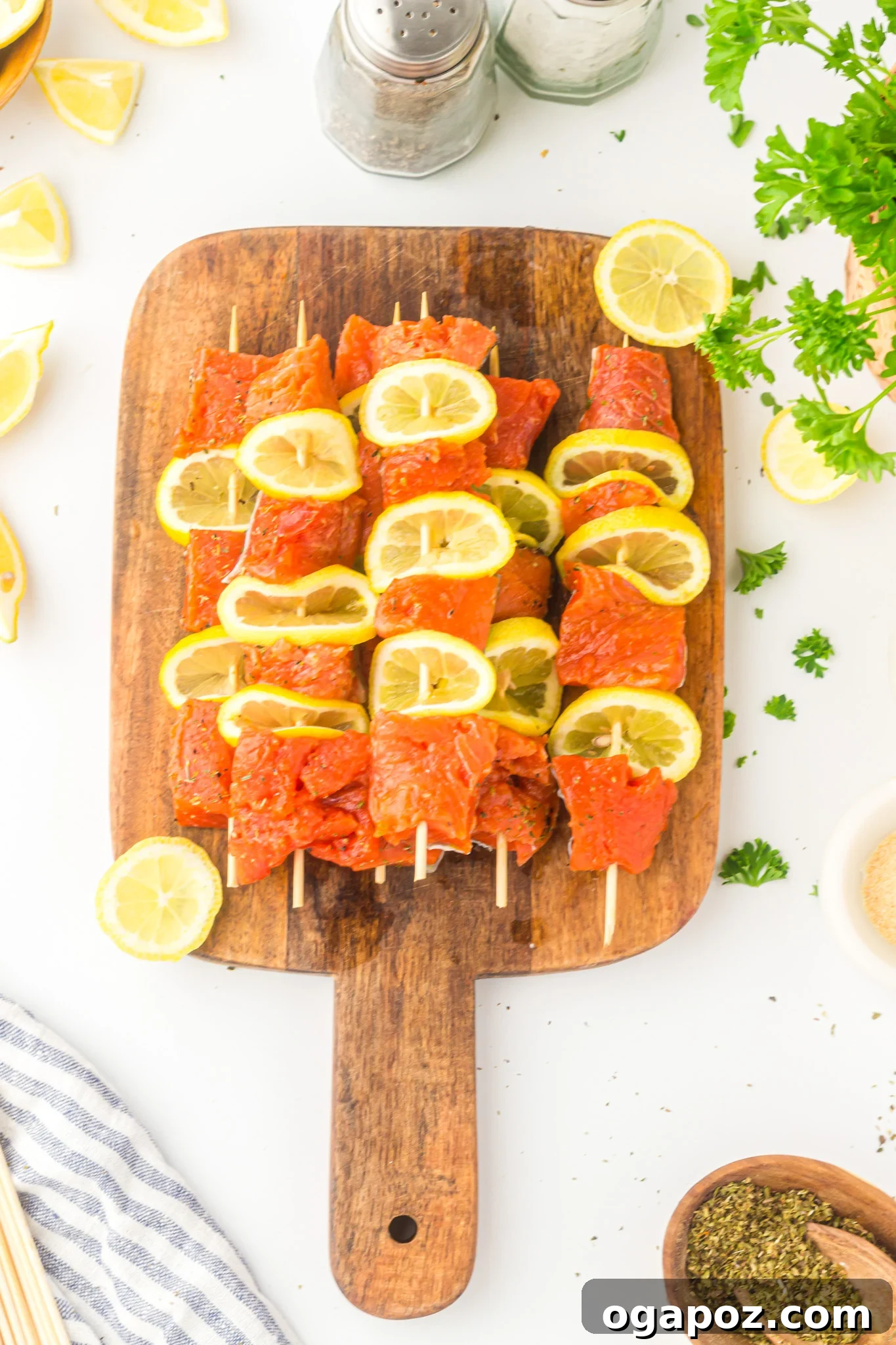 Quick Zesty Salmon Skewers 9 Assembled Easy Lemon Salmon Kabobs on skewers with lemon slices, ready to be cooked.