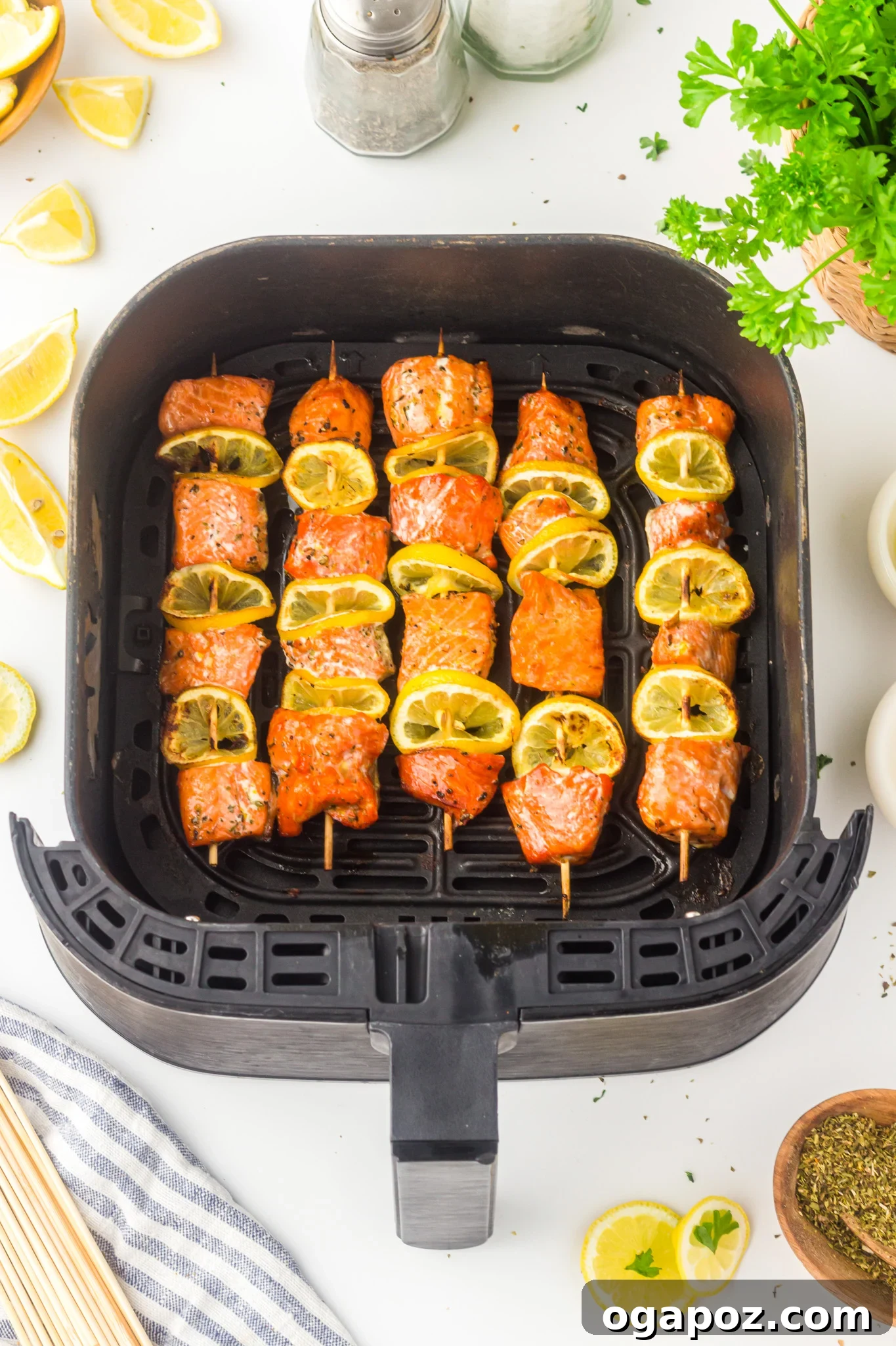 Quick Zesty Salmon Skewers 10 Easy Lemon Salmon Kabobs cooking inside an air fryer basket, showing a healthy and quick cooking method.