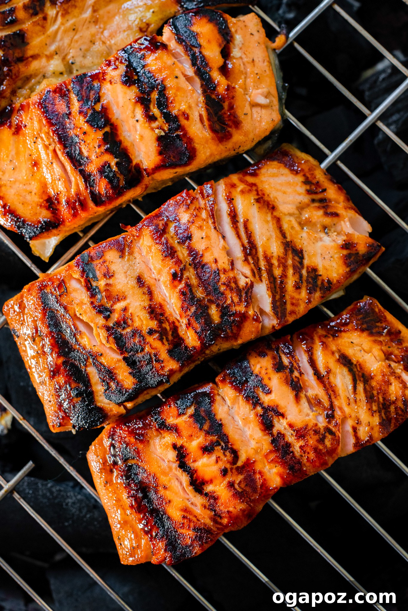 Honey Mustard Salmon cooking on a hot grill, showing grill marks and a slight char.