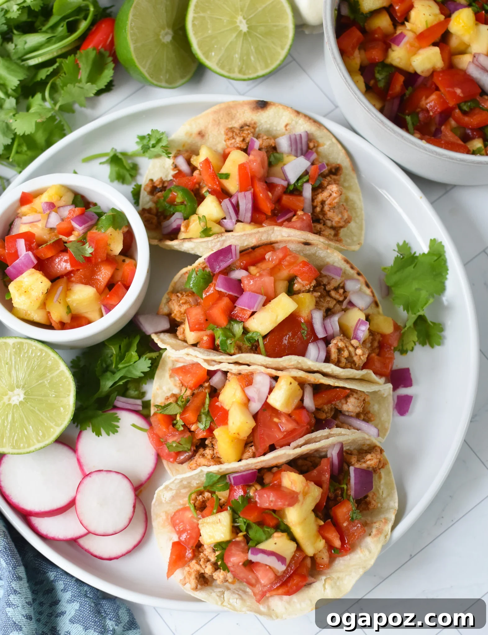No-Fuss Ground Pork Tacos 2 Easy Ground Pork Tacos on white plate.