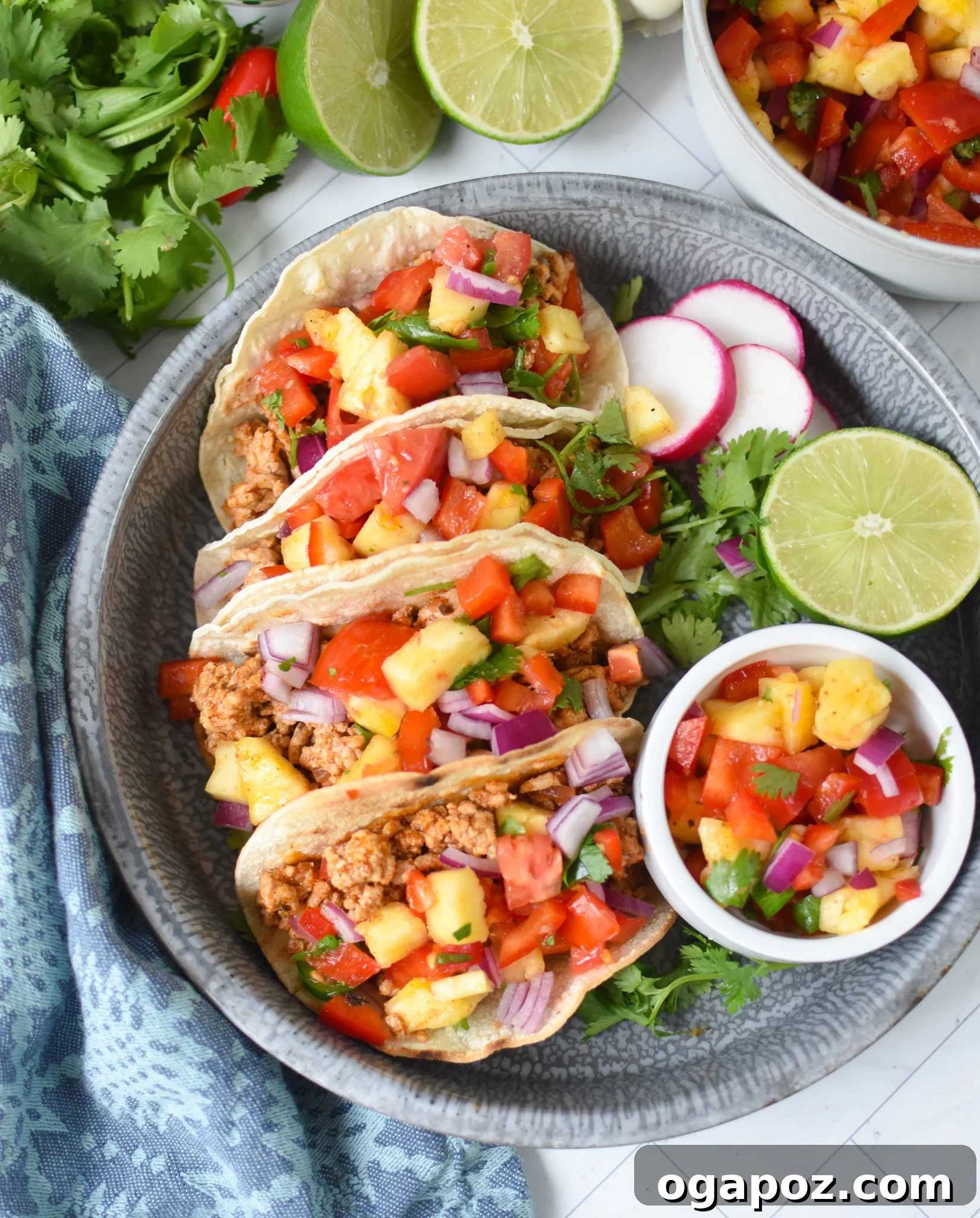 No-Fuss Ground Pork Tacos 4 Easy Ground Pork Tacos on a blue platter.